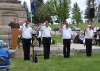 Members of the Great Falls Marine Corp League salute during a helmet and rifle ceremony as part of  the annual Memorial Day program May 26 at Highland Cemetery in Great Falls, Mont.   It was the city’s 146 observance of Memorial Day, which honors those who have died while serving in the U.S. military. (U.S. Air Force photo/Christy Mason)