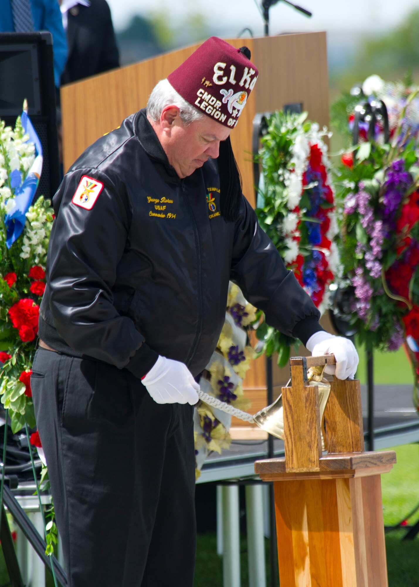 A member of the the Shrine Club Legion of Honor performs a veterans memorial tribute during the Memorial Day celebration at Medical Lake, Wash., May 26, 2014. (U.S. Air Force photo by Staff Sgt. Michael Means/Released)