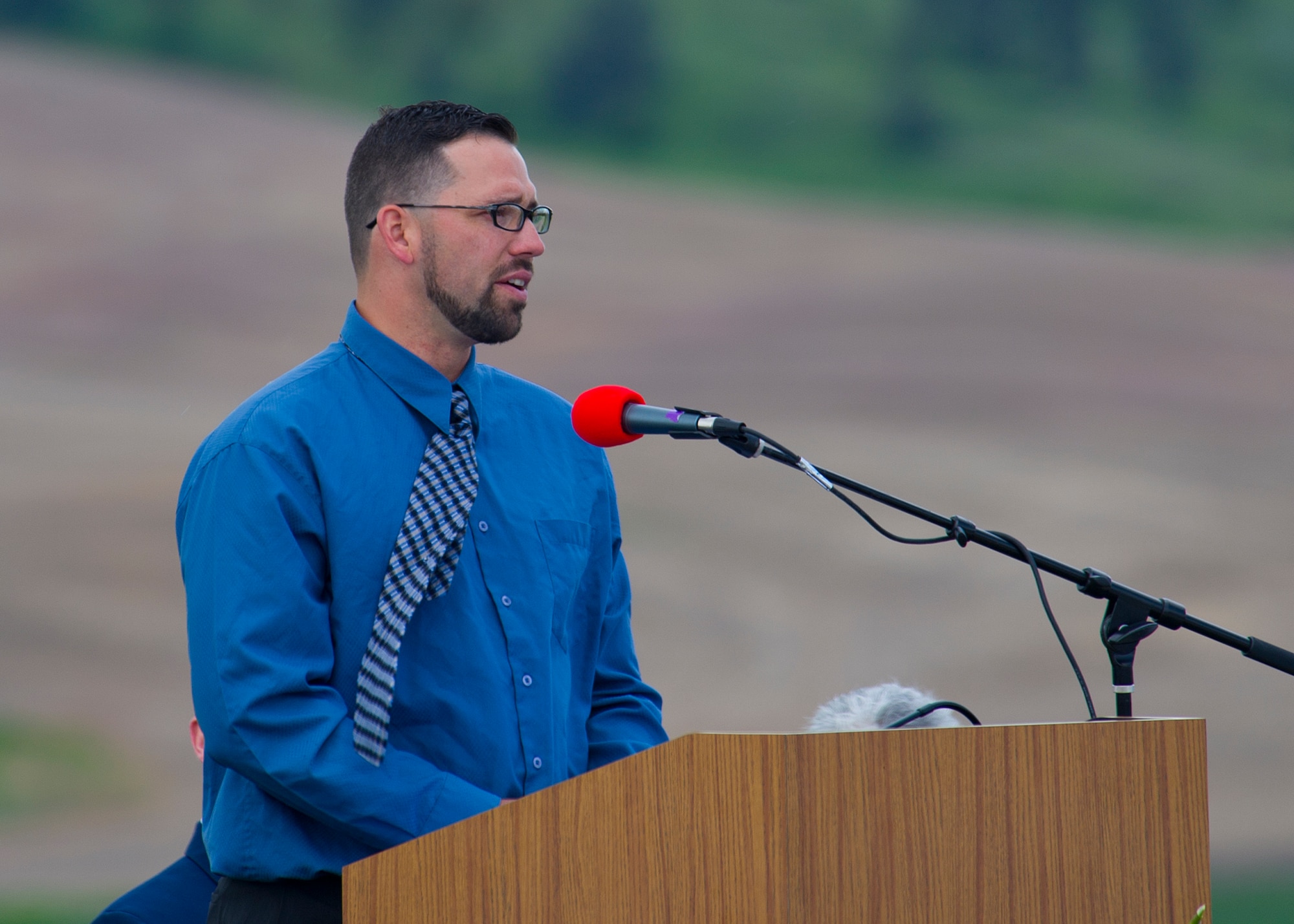 U.S. Marine Corp Sgt. (Ret.) Josh Elliott speaks during the Memorial Day Celebration about his service at Medical Lake, Wash., May 26, 2014. Elliot is purple heart recipient after wounds he received while deployed to Iraq. (U.S. Air Force photo by Staff Sgt. Michael Means/Released)