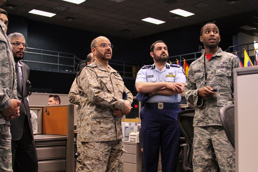 Tech. Sgt. Reginald Williams, Senior Duty Technician assigned to the 612th Air and Space Operations Center, briefs Lt. Gen. Fayyadh Al-Ruwaili, Commander of the Royal Saudi Air Force, on the mission capabilities of the Air and Space Operations Center during his tour of Davis-Monthan AFB, Ariz., May 8, 2014.   Al-Ruwaili visited Davis-Monthan AFB by invitation of the Chief of Staff of the Air Force during a counterpart visit.  The primary purpose of visit is to observe Exercise ANGEL THUNDER operations as well as receive an orientation at the 12 AF (AFSOUTH) Air and Space Operations Center.  (U.S. Air Force photo by Tech. Sgt. Heather R. Redman/Released)