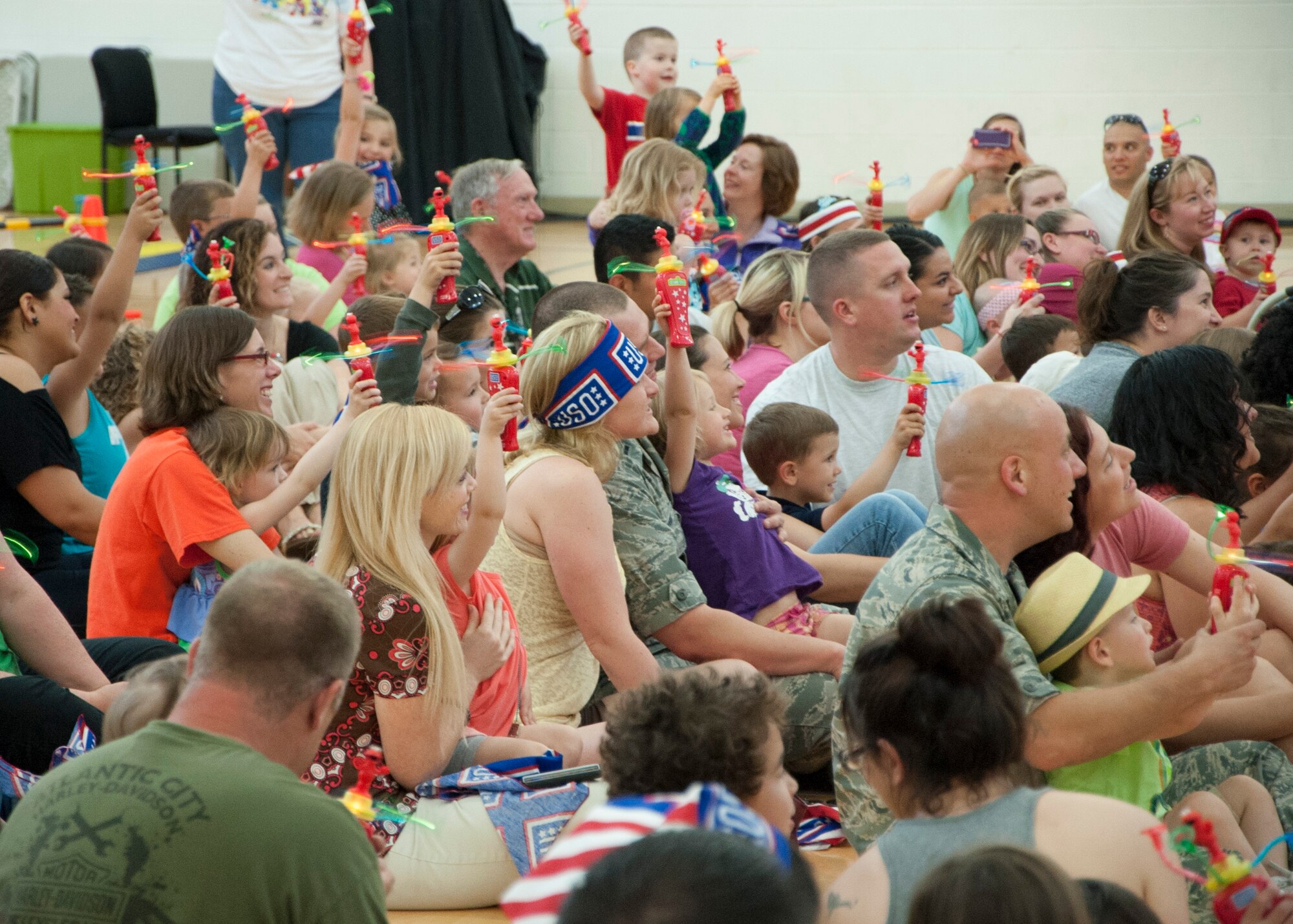 Children and parents excitedly wait for the start of Sesame Street live hosted by the United Service Organization May 22, 2014, at the Youth Center on Dover Air Force Base, Del.  The show was an interactive way for the children to learn about resiliency and military families. (U.S. Air Force photo/Senior Airman Jared Duhon)  