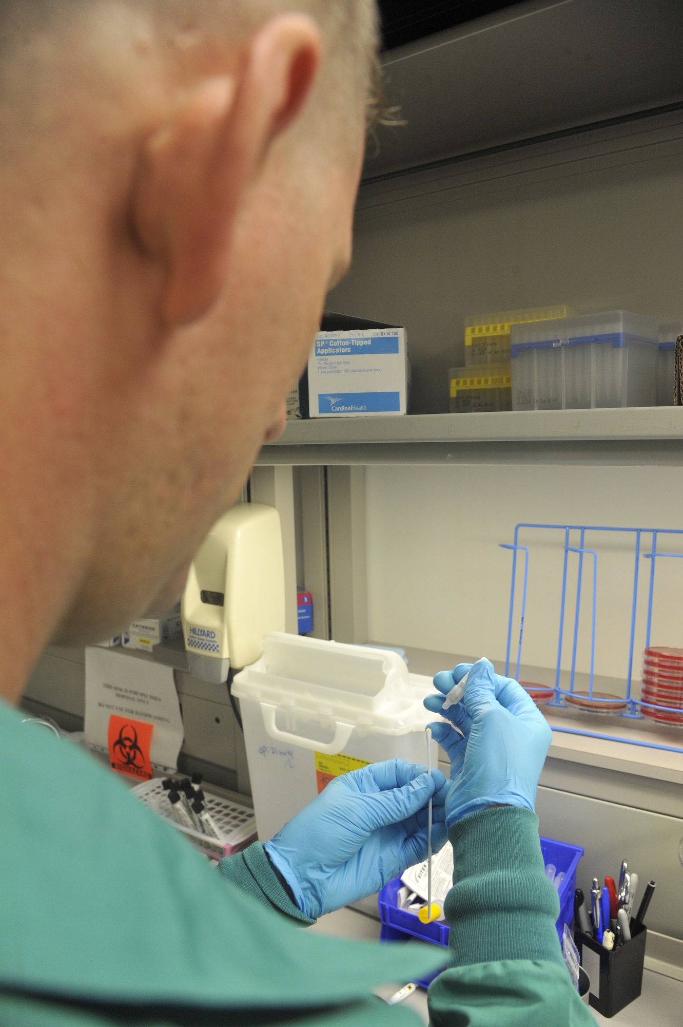 U.S. Air Force Staff Sgt. Jon Ringenoldus, 509th Medical Support Squadron medical laboratory technician, performs oxidase test at Whiteman Air Force Base, Mo., May 13, 2014. This test is performed to examine certain types of bacterial proteins. (U.S. Air Force photo by Airman 1st Keenan Berry/Released)