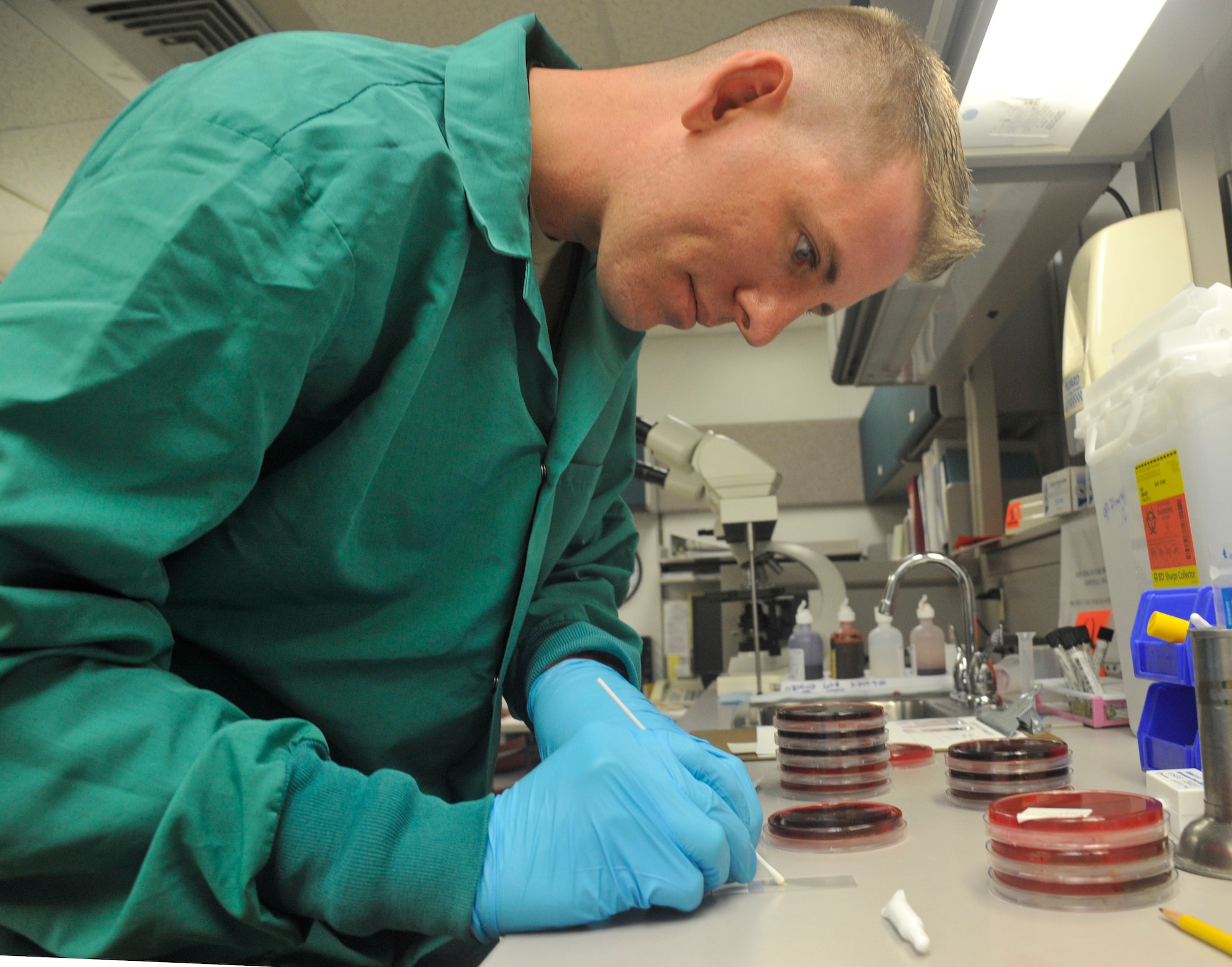 U.S. Air Force Staff Sgt. Jon Ringenoldus, 509th Medical Support Squadron medical laboratory technician, performs a catalase test at Whiteman Air Force Base, Mo., May 13, 2014. This test is done to differentiate between staphylococci (catalase-positive) from streptococci (catalase-negative) bacteria. (U.S. Air Force photo by Airman 1st Keenan Berry/Released) 