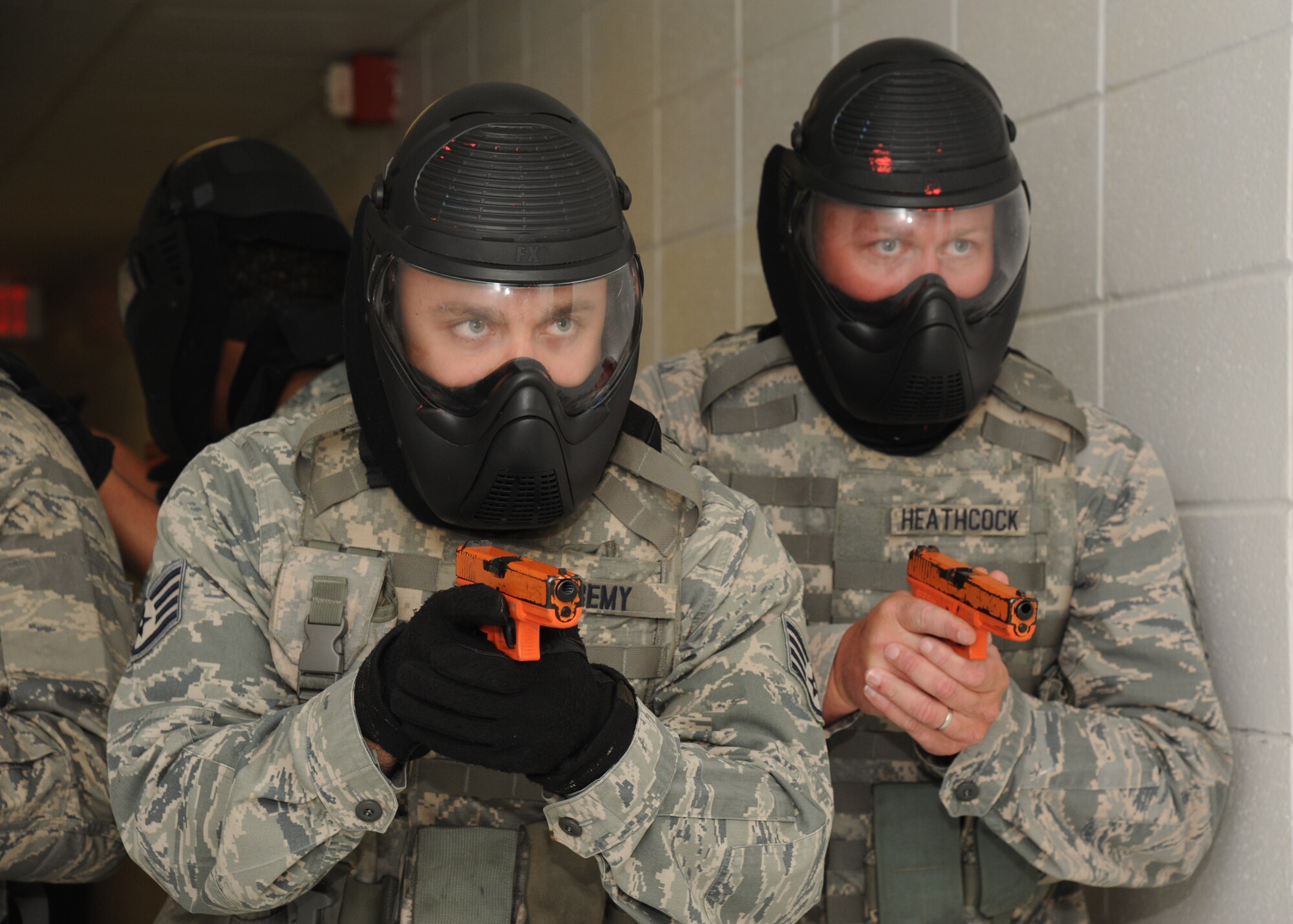 Staff Sgts. Joshua Remy and James Heathcock, 186th Air Refueling Wing, Meridian Miss., go through various scenarios simulating real-world conditions during an active shooter training session hosted by the Federal Bureau of Investigation May 21, 2014, at the Locker House, Keesler Air Force Base, Miss.  The two-day Advanced Law Enforcement Rapid Response Training focused on terrorism response tactics, which is designed to prepare the first responder to isolate, distract, and neutralize an "active shooter."  (U.S. Air Force photo by Kemberly Groue)