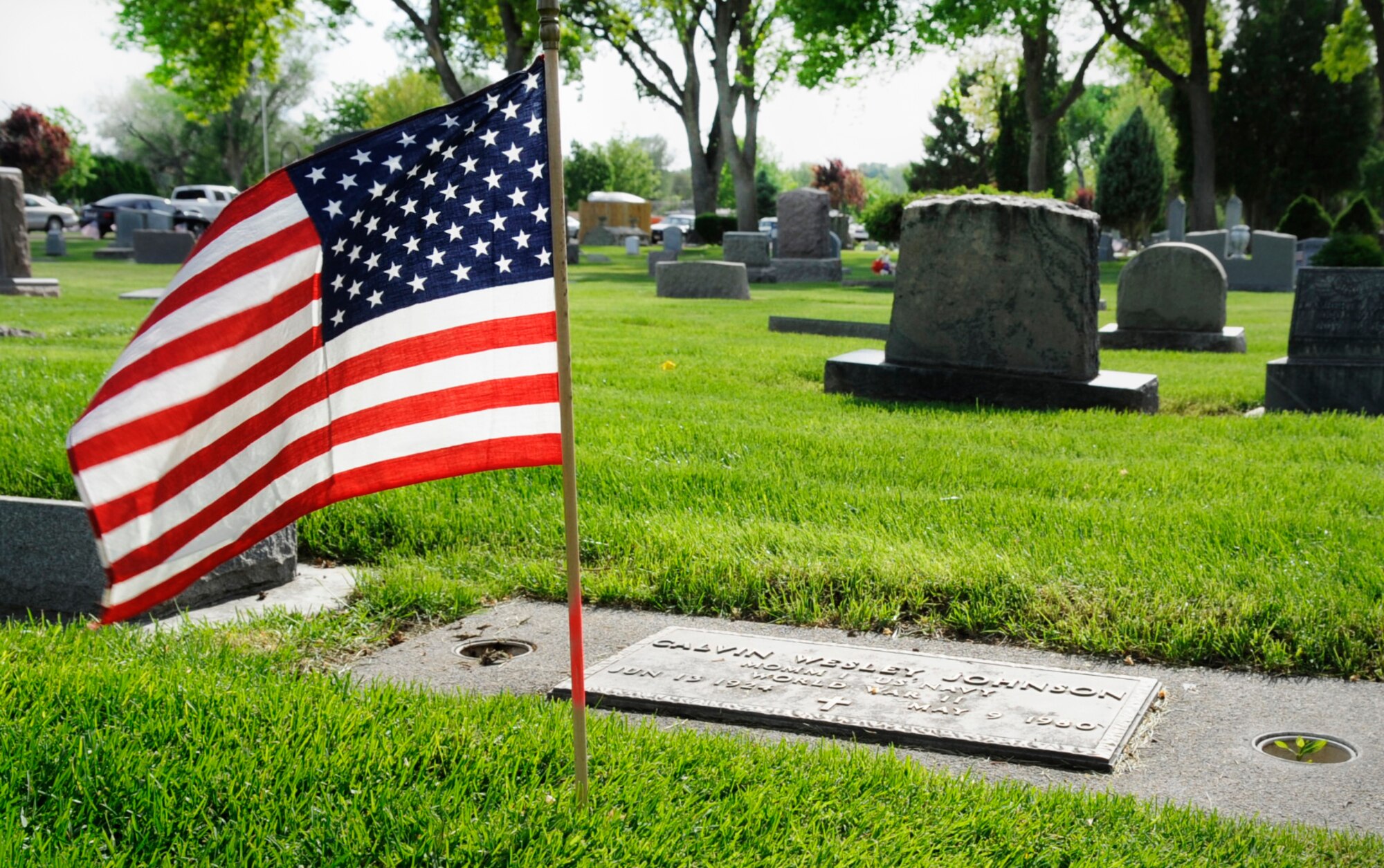 Flags honor the graves of those who served in the United States military during the Memorial Day observance at the Mountain View Cemetery in Mountain Home, Idaho, May 26, 2014. Airman from Mountain Home Air Force Base stood in formation throughout the ceremony as a visual reminder of the unique relationship the base has with the local community. (U.S. Air Force photo by Senior Airman Caitlin Guinazu/RELEASED)