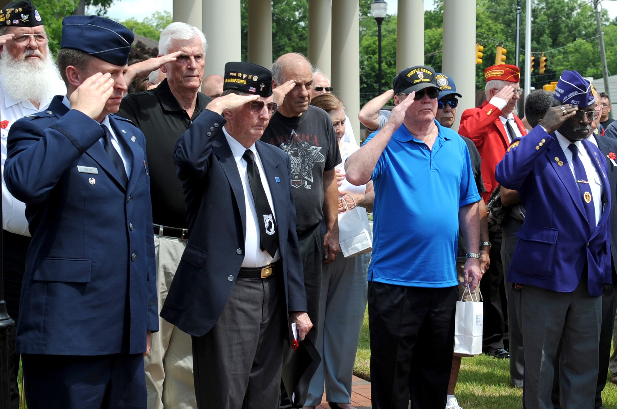 Retired U.S. Army Col. Walter Marm, Jr., Medal of Honor recipient, salutes during taps, May 26, 2014, at the Wayne County Veteran’s Memorial in Goldsboro, North Carolina. Marm spoke about the events he encountered during his time in Vietnam and how he earned the Medal of Honor. (U.S. Air Force photo/Senior Airman Mariah Tolbert)