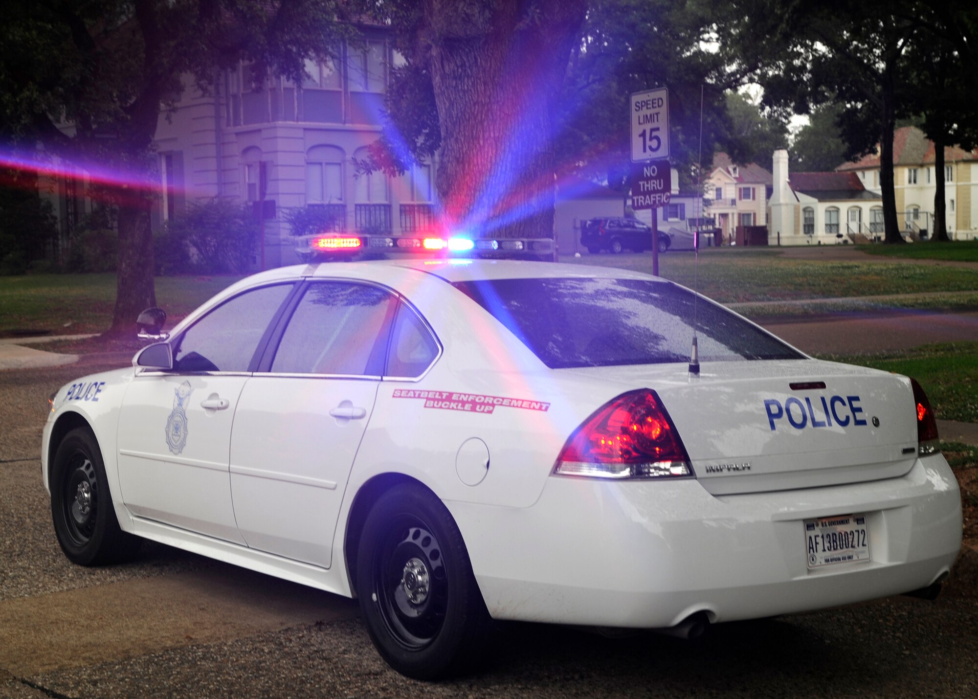 A 2nd Security Forces Squadron patrol car lights are lit to alert oncoming traffic of a seat belt inspection on Barksdale Air Force Base, La., May 27, 2014. Security Forces patrolmen randomly performed seat belt checks across the base to help promote Click It or Ticket month. (U.S. Air Force photo/Senior Airman Joseph A. Pagán Jr.)