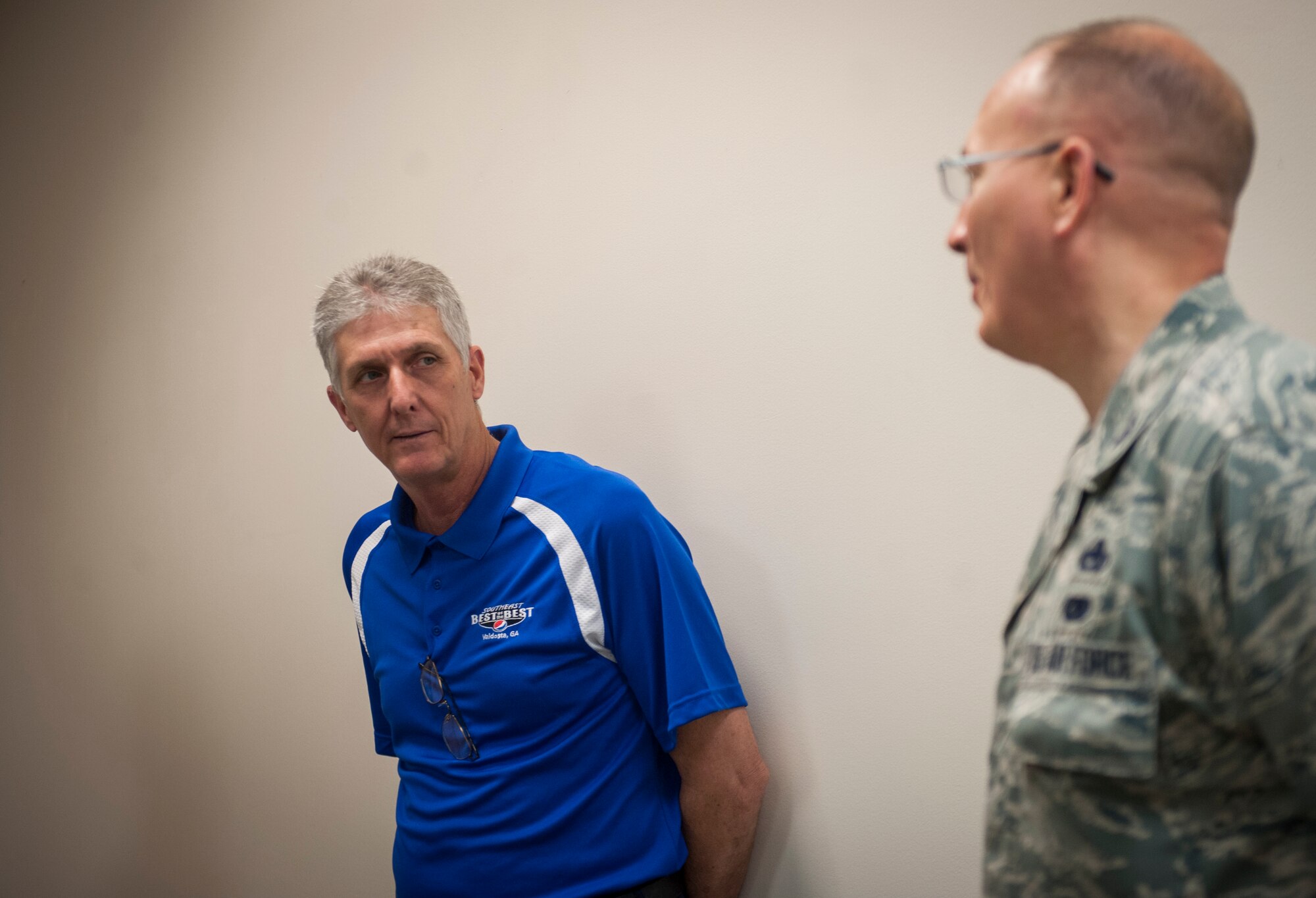 Rick Walker, Pepsi supply chain operations supervisor, talks to U.S. Air Force Col. Jeffrey W. Decker, 23d Maintenance Group commander, during a base visit at Moody Air Force Base, Ga., May 20, 2014. Moody Airmen previously visited a Pepsi facility as part of an ongoing effort between the two organizations to innovate and broaden logistics processes. (U.S. Air Force photo by Senior Airman Jarrod Grammel/Released)
