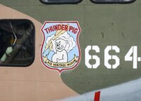 The “Thunder Pig” artwork is displayed on the side of the only C-123 cargo aircraft still able to fly, here, May 17, 2014. The Air Heritage Museum of Chippewa, Pennsylvania, brought the restored C-123 to the 2014 Thunder Over the Valley Air Show here, May 17-18. U.S. Air Force photo/Tech. Sgt. Jim Brock.