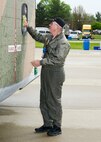 Bill Gbur, crew chief and flight engineer for the Air Heritage Museum’s C-123 “Thunder Pig” warbird, cleans a window on the aircraft here, May 17, 2014. The Air Heritage Museum of Chippewa, Pennsylvania, brought the restored C-123, which is the only C-123 still able to fly, to the 2014 Thunder Over the Valley Air Show here, May 17-18. U.S. Air Force photo/Tech. Sgt. Jim Brock.