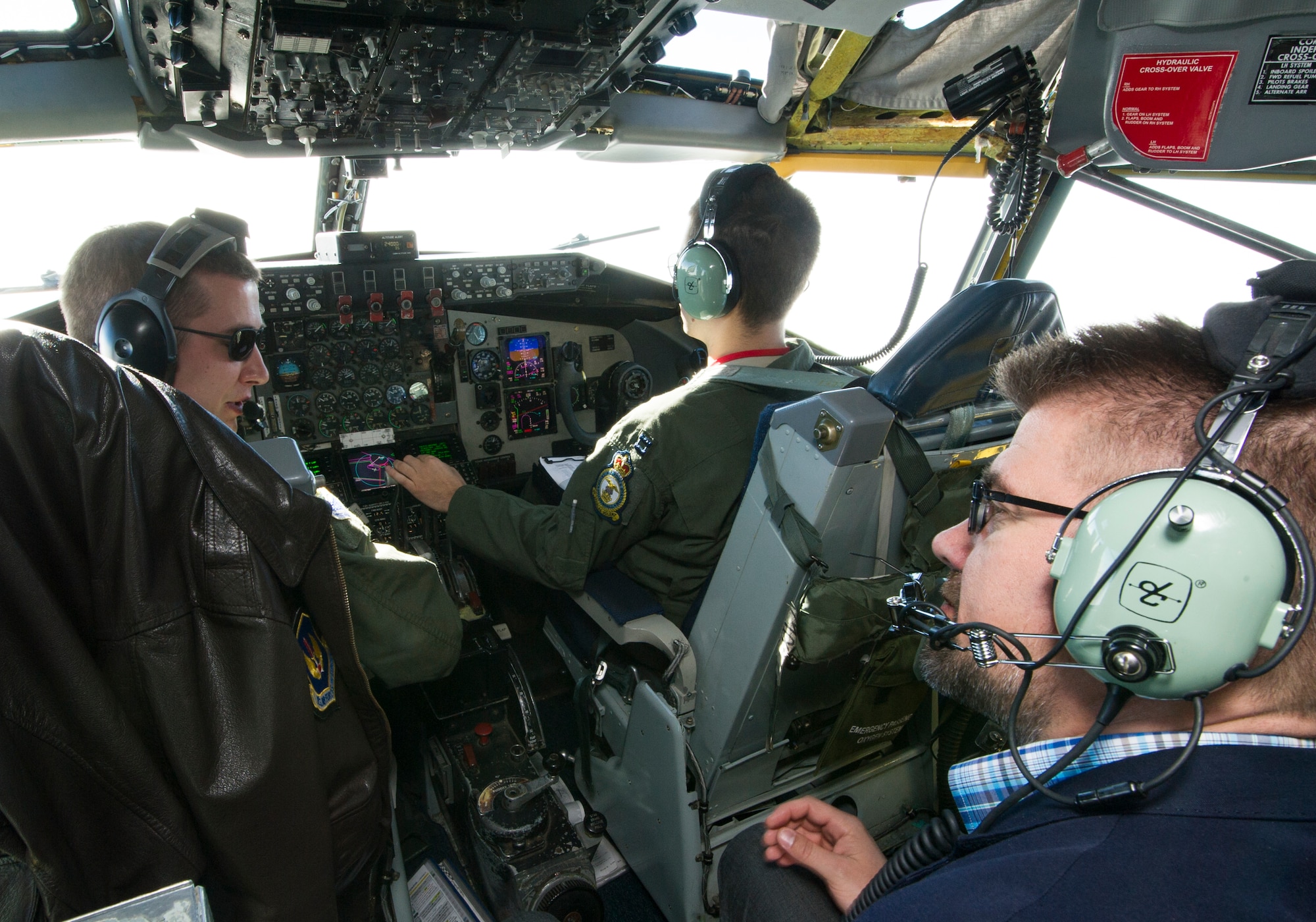 KEFLAVIK, Iceland -- Icelandic Minister of Foreign Affairs Gunnar Sveinsson speaks with 48th Air Expeditionary Group KC-135 Stratotanker pilots during flight near Keflavik International Airport May 27, 2014. The minister flew on the mission to view first-hand the U.S.-led Icelandic Air Policing mission currently happening there. (U.S. Air Force photo/Tech. Sgt. Benjamin Wilson)(Released)
