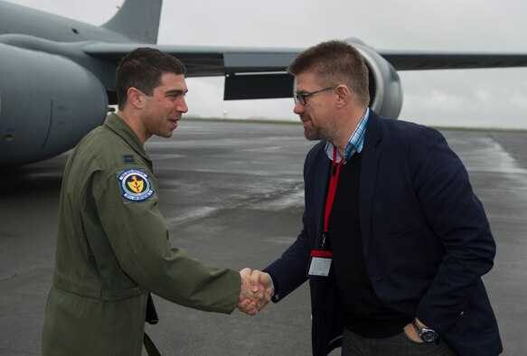 U.S. Air Force Capt. Mike Gargano, 48th Air Expeditionary Group KC-135 Stratotanker pilot from RAF Mildenhall, England, greets Icelandic Minister of Foreign Affairs Gunnar Sveinsson May 27, 2014, during the minister's visit to Keflavik International Airport in Iceland. The minister visited the airport to view first-hand the U.S. mission of Icelandic Air Policing currently happening there. (U.S. Air Force photo by Tech. Sgt. Benjamin Wilson/Released)