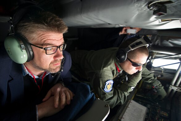 Icelandic Minister of Foreign Affairs Gunnar Sveinsson watches as U.S. Air Force Tech. Sgt. Joseph Blakely, KC-135 Stratotanker boom operator from RAF Mildenhall, England, offloads fuel during a mission May 27, 2014, near Keflavik International Airport in Iceland. The minister flew on the mission to view first-hand the U.S.-led Icelandic Air Policing mission currently happening there. (U.S. Air Force photo by Tech. Sgt. Benjamin Wilson/Released)