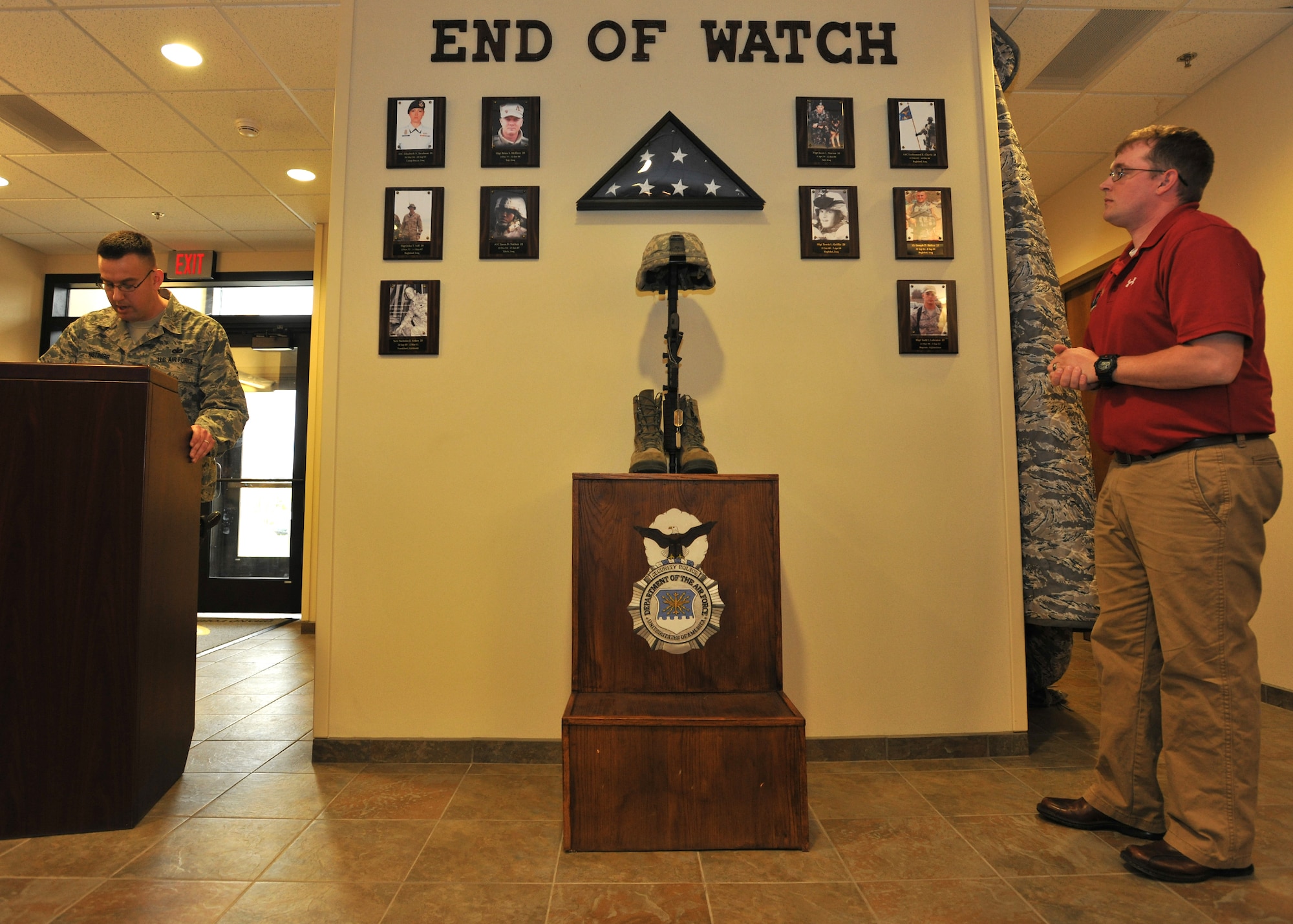 Staff Sgt. James Hastings, 319th Security Forces Squadron, reads off the names of fallen Security Forces Airmen represented by the Defender Memorial May 21, 2014, on Grand Forks Air Force Base, N.D. The memorial is dedicated to ten Airmen who have made the ultimate sacrifice since April 1997. (U.S. Air Force photo/Senior Airman Xavier Navarro)
