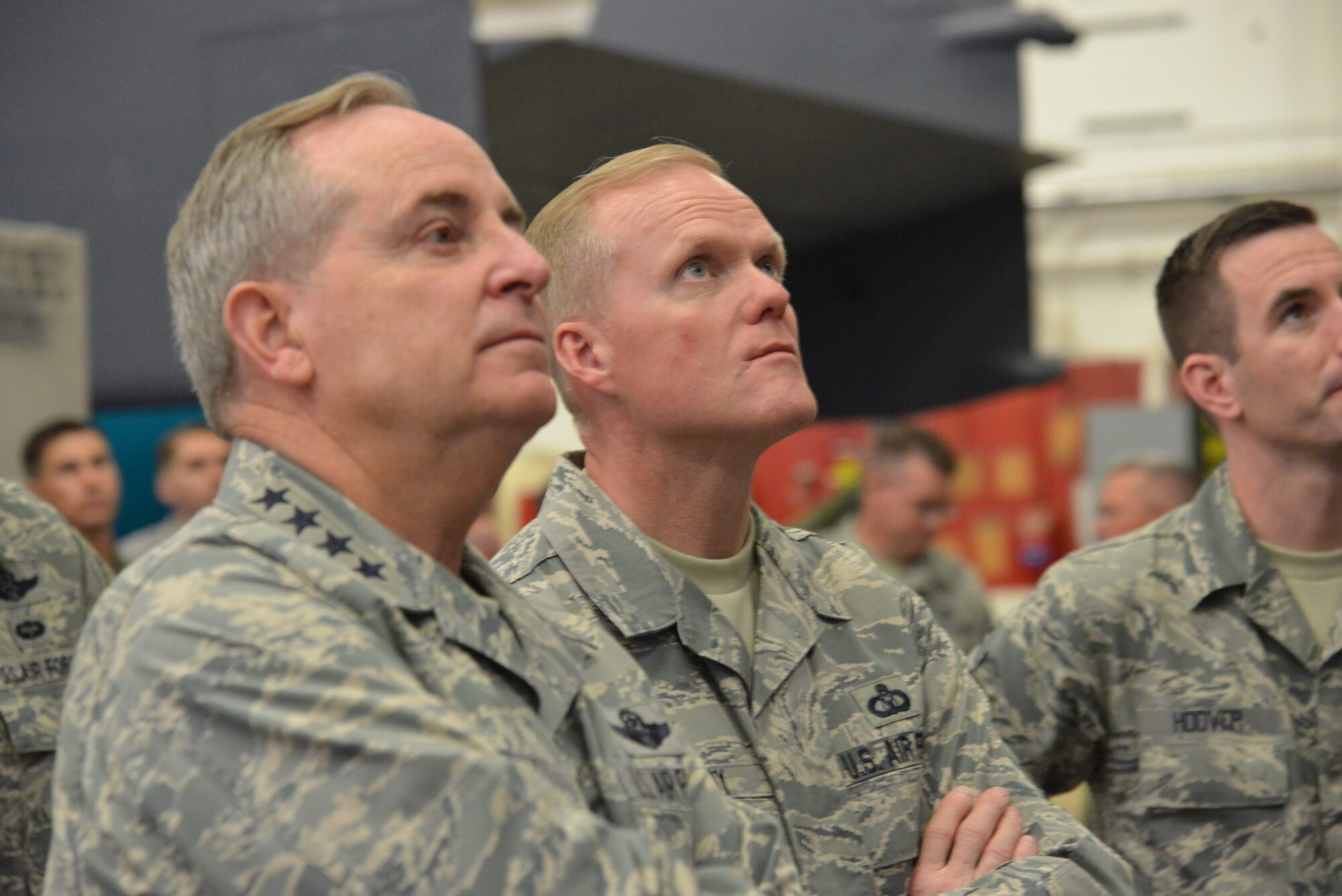 Gen. Mark A. Welsh III, Chief of Staff of the Air Force, and Chief Master Sgt. of the Air Force James Cody eye helicopter maintenance during a tour of the hangar during a May 20 visit to Kirtland. The general and chief spent several days at the base touring facilities and meeting with Airmen. (Photo by Ken Moore)
