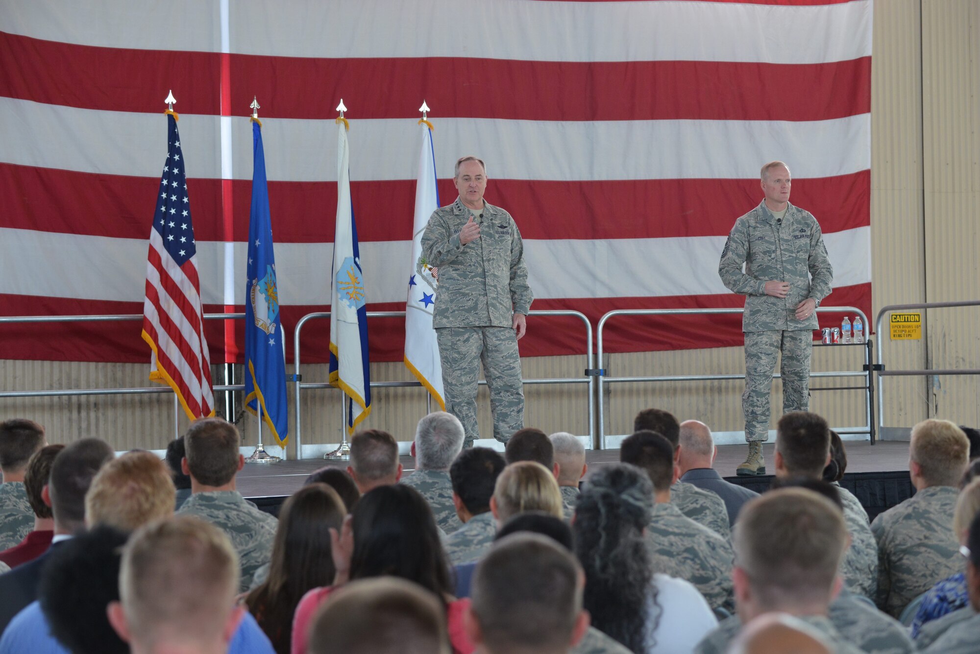 Gen. Mark A. Welsh III, Chief of Staff of the Air Force, and Chief Master Sgt. of the Air Force James Cody speak to Airmen during an all call May 20 during a visit to Kirtland Air Force Base, N.M. The duo spent several days at the base touring facilities and
meeting with Airmen.  (Photo by Ken Moore)