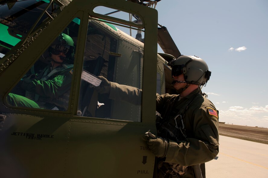 Staff Sgt. Jake Gornbein, 54th Helicopter Squadron special missions aviator instructor, prepares for take-off at Minot Air Force Base, N.D., May 13, 2014. SMAs mission at Minot AFB is 24/7 Nuclear Security for not only the 791st Missile Security Forces Squadron convoys section but the missile field as well. (U.S. Air Force photo/Senior Airman Brittany Y. Bateman)