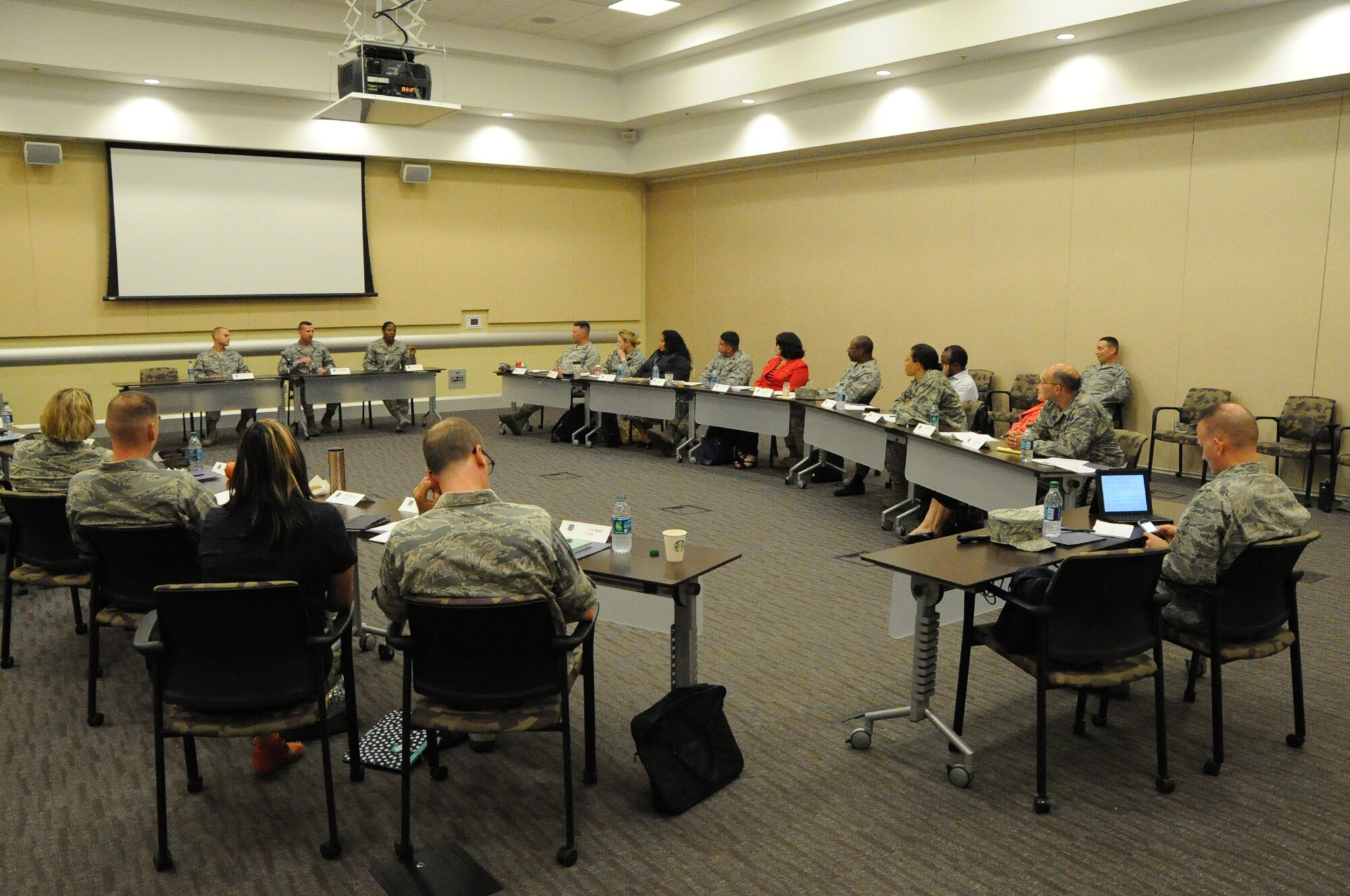 (Left to right) Master Sgt. Eric Villafana, 11th Wing first sergeant, Senior Master Sgt. Johnny Hamm, Air Force District of Washington first sergeant, and Master Sgt. Angelique Barnes, Air Force Band first sergeant, speak to officers who have either prior command experience or expect to assume command during the 2014 AFDW Commander’s Course at Joint Base Andrews, Md., May 21, 2014. The course provides information to commanders about force management, resiliency and the total force mission in the National Capital Region. (U.S. Air force photo/Staff Sgt. Matt Davis)