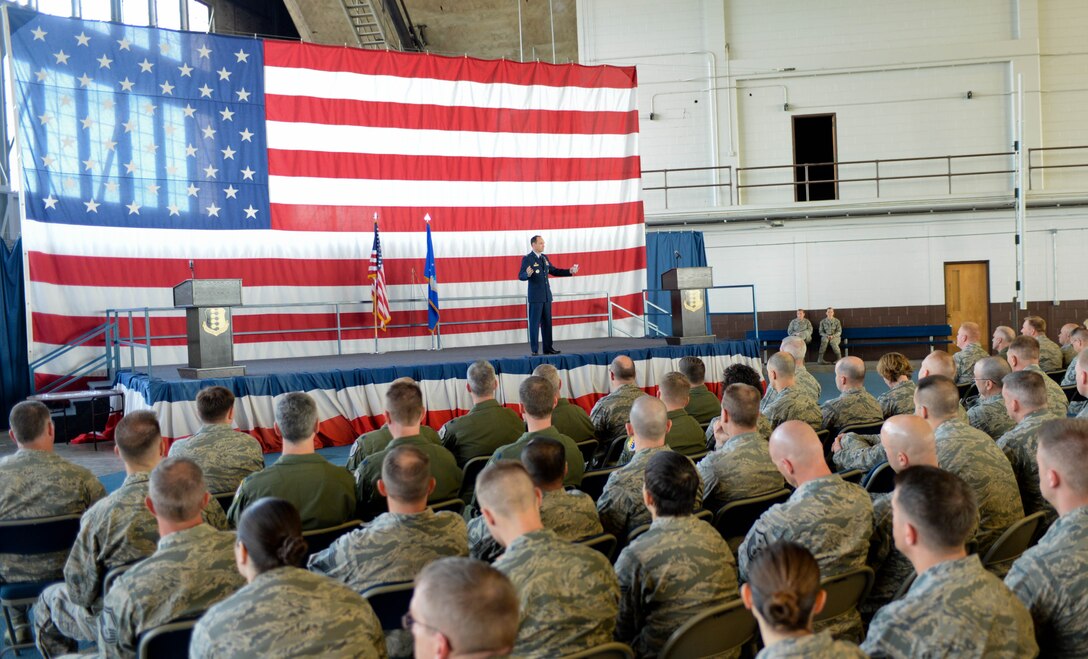 Col. Kevin Kennedy, 28th Bomb Wing commander, addresses the Airmen under his command during a commander’s call in the Pride Hangar at Ellsworth Air Force Base, S.D., May 22, 2014. Kennedy commended the Airmen for their contributions to the mission, touched on the results of the recent Unit Effectiveness Inspection, encouraged everyone to remember the essence of Memorial Day and stressed that each Airman make safety a priority during all their summer activities. (U.S. Air Force photo by Senior Airman Zachary Hada/Released)