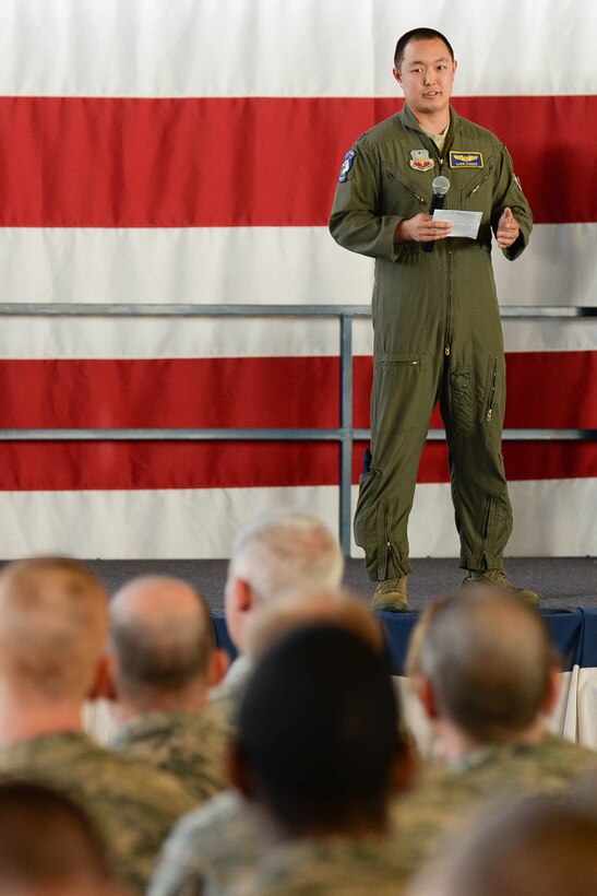 Capt. Gavin O’brien, 28th Bomb Wing chief of safety, speaks to Airmen about staying diligent when it comes to summer safety during a wing commander’s call in the Pride Hangar at Ellsworth Air Force Base, S.D., May 22, 2014. O’brien encouraged Airmen to practice mishap prevention during summer activities. (U.S. Air Force photo by Senior Airman Zachary Hada/Released)