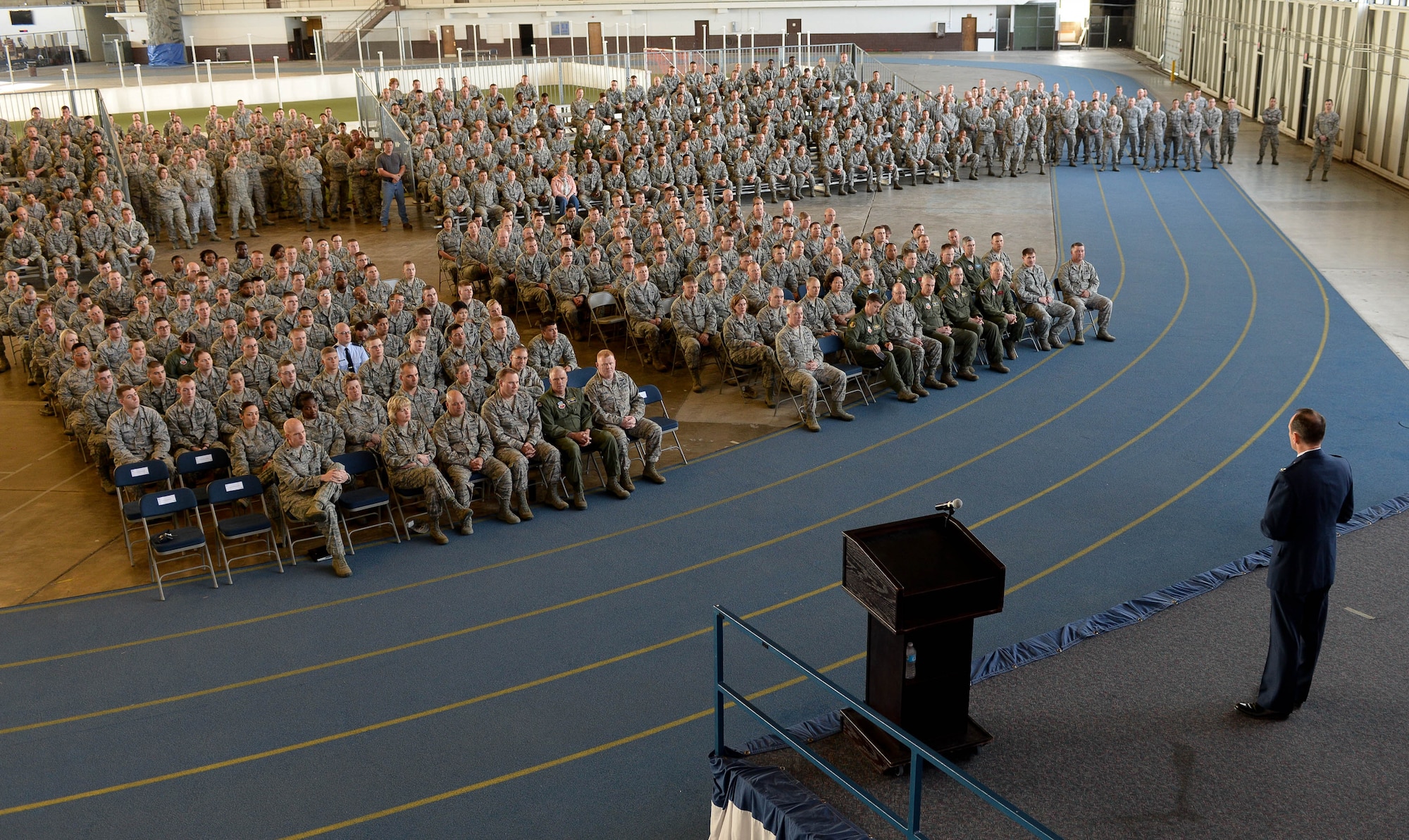 Col. Kevin Kennedy, 28th Bomb Wing commander, commended the base for its commitment to accomplishing the mission during a commander’s call in the Pride Hangar at Ellsworth Air Force Base, S.D., May 22, 2014. During the event, Kennedy covered many topics including summer safety, morale and the results of a recent Unit Effectiveness Inspection. (U.S. Air Force photo by Senior Airman Zachary Hada/Released)