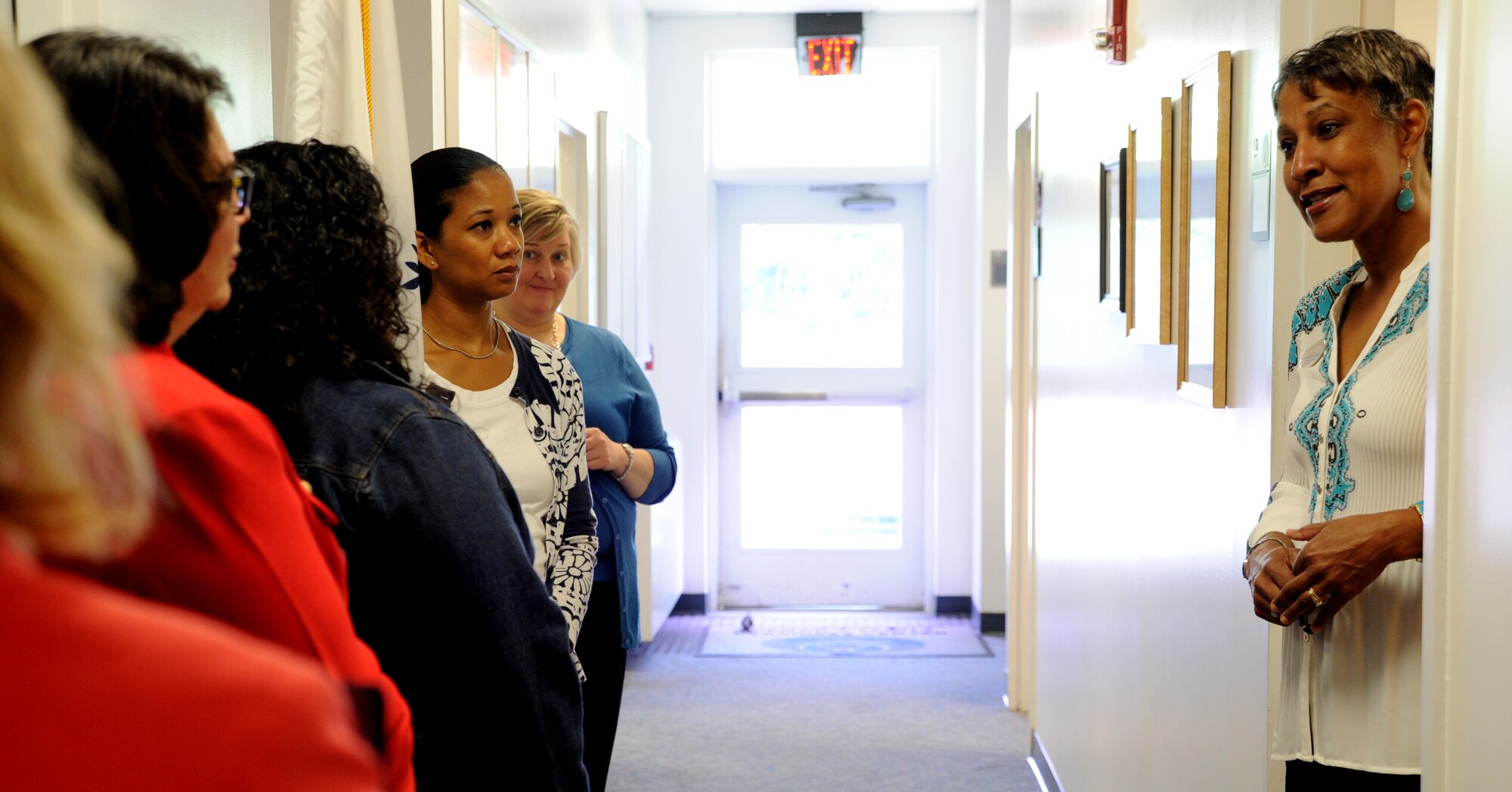 Adreinne Barnett explains the Exceptional Family Member Program to spouses of incoming commanders at Joint Base Andrews, Md., May 22, 2014. The spouses participated in the Air Force District of Washington’s annual Commander's Course to enhance their knowledge of the command's mission and support tools here May 20-23. Barnett is a Military & Family Readiness Center family support specialist.  She supports more than 12,000 EFMP members in the National Capital Region. (U.S. Air Force photo/Master Sgt. Tammie Moore)