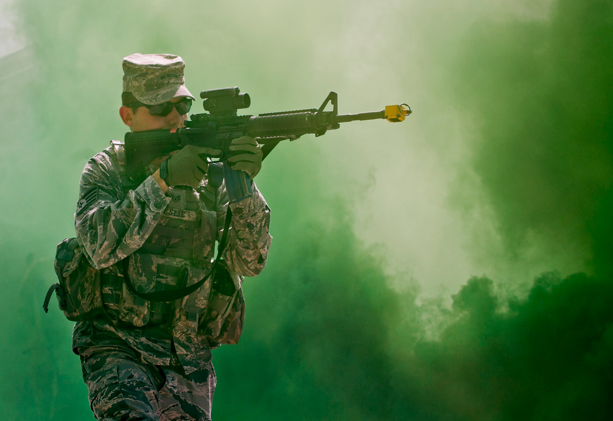 Staff Sgt. Richard Leslie, of the 96th Ground Combat Training Squadron, moves through the cover of smoke during a high value target capture demonstration at Eglin Air Force Base, Fla.  The squadron is responsible for “Brave Defender” deployment training for approximately 1,500 Air Force security forces Airmen per year.  The squadron is scheduled for deactivation this summer.  (U.S. Air Force photo/Samuel King Jr.)