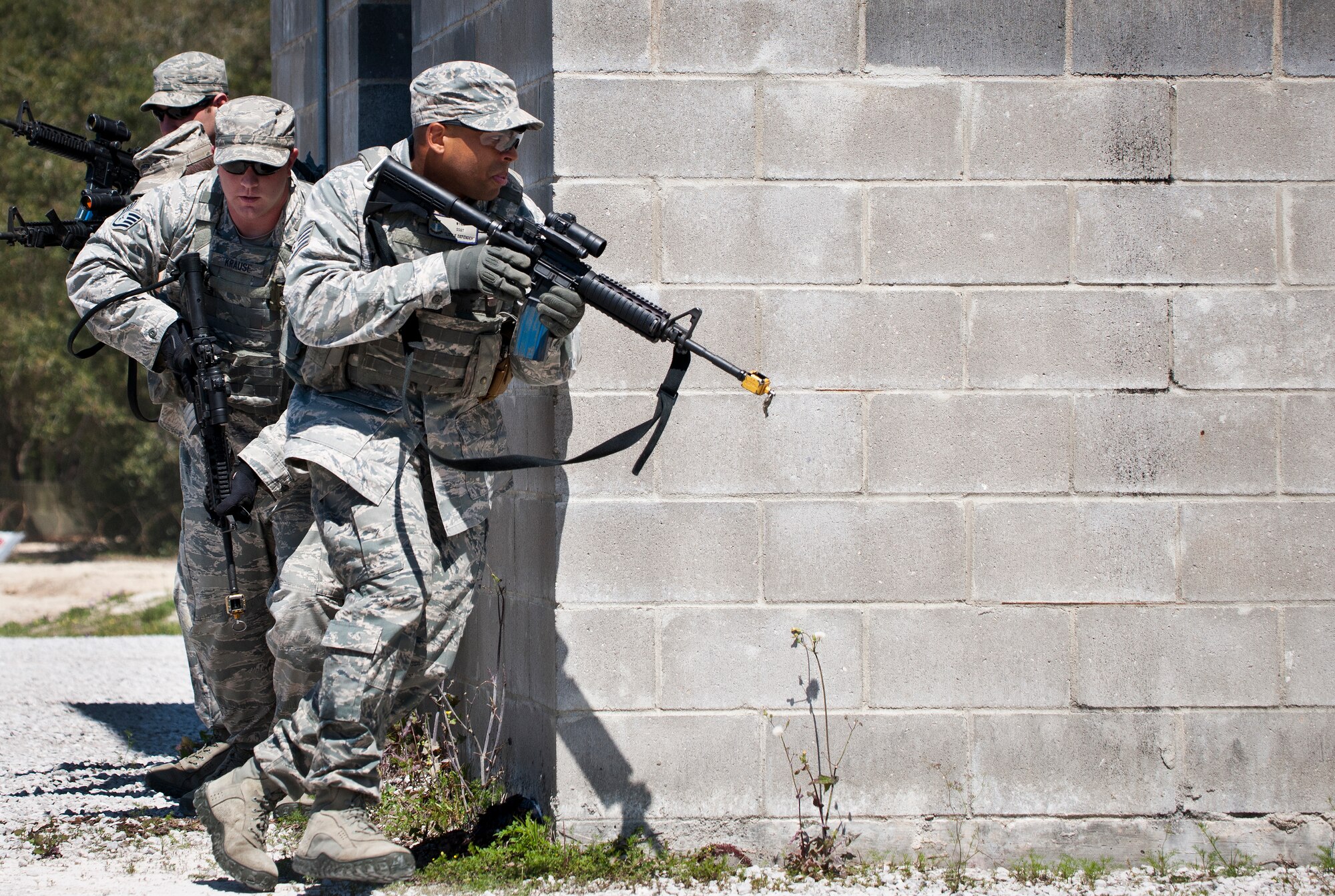 A fire team from the 96th Ground Combat Training Squadron moves in toward their target during a high value target capture demonstration at Eglin Air Force Base, Fla.  The squadron is responsible for “Brave Defender” deployment training for approximately 1,500 Air Force security forces Airmen per year.  The squadron is scheduled for deactivation this summer.  (U.S. Air Force photo/Samuel King Jr.)
