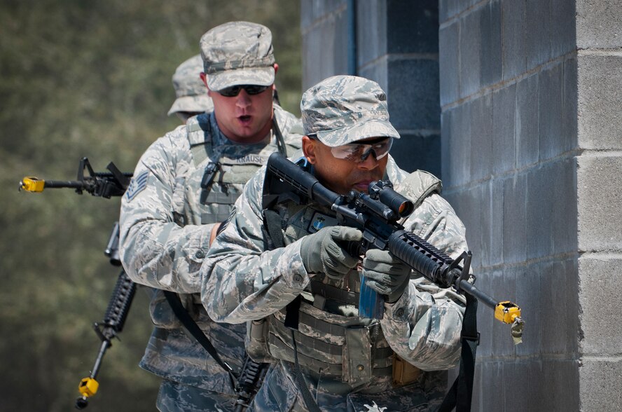 A fire team from the 96th Ground Combat Training Squadron moves in toward their target during a high value target capture demonstration at Eglin Air Force Base, Fla.  The squadron is responsible for “Brave Defender” deployment training for approximately 1,500 Air Force security forces Airmen per year.  The squadron is scheduled for deactivation this summer.  (U.S. Air Force photo/Samuel King Jr.)