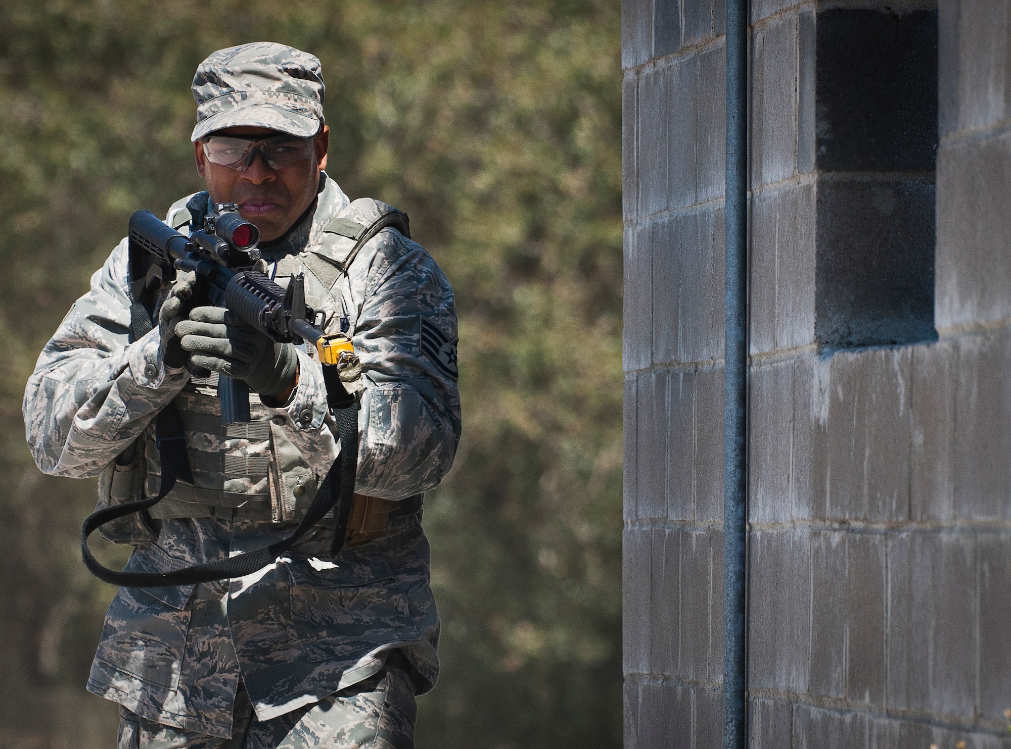 Staff Sgt. Sterling Wynn, a 96th Ground Combat Training Squadron instructor, moves in toward the target during a high value target capture demonstration at Eglin Air Force Base, Fla.  The squadron is responsible for “Brave Defender” deployment training for approximately 1,500 Air Force security forces Airmen per year.  The squadron is scheduled for deactivation this summer.  (U.S. Air Force photo/Samuel King Jr.)