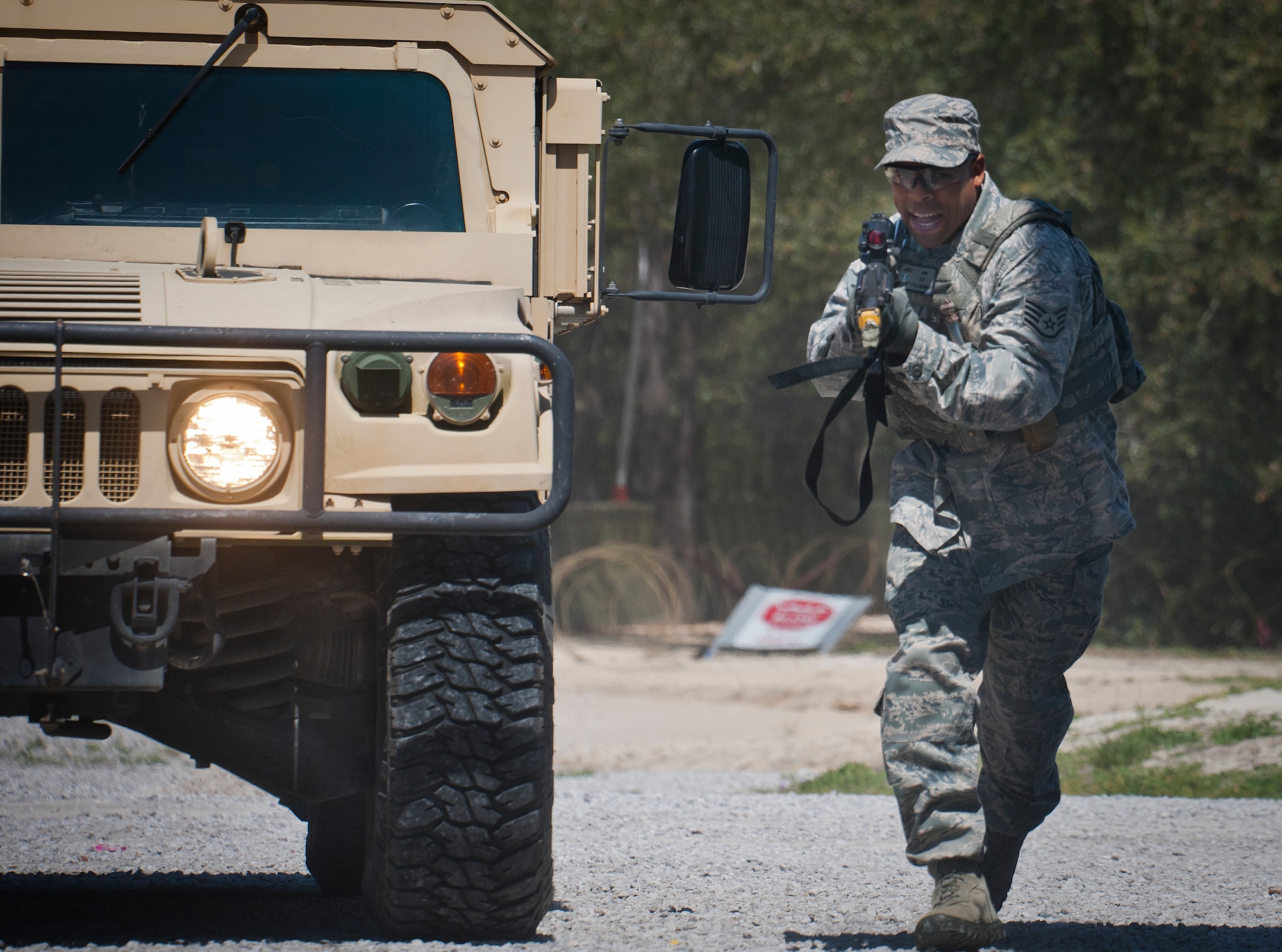 Staff Sgt. Sterling Wynn, a 96th Ground Combat Training Squadron instructor, moves in toward the target during a high value target capture demonstration at Eglin Air Force Base, Fla.  The squadron is responsible for “Brave Defender” deployment training for approximately 1,500 Air Force security forces Airmen per year.  The squadron is scheduled for deactivation this summer.  (U.S. Air Force photo/Samuel King Jr.)