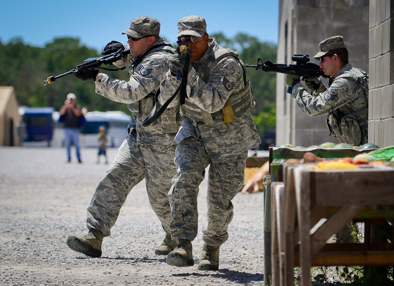A fire team from the 96th Ground Combat Training Squadron moves in toward their target during a high value target capture demonstration at Eglin Air Force Base, Fla.  The squadron is responsible for “Brave Defender” deployment training for approximately 1,500 Air Force security forces Airmen per year.  The squadron is scheduled for deactivation this summer.  (U.S. Air Force photo/Samuel King Jr.)