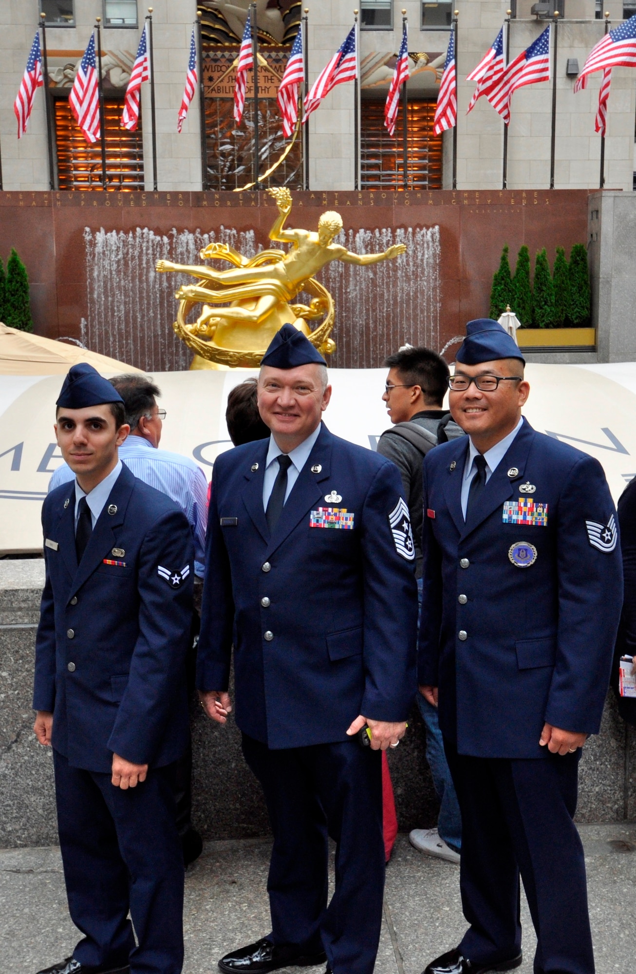 Airman 1st Class Anthony Vinci, Command Chief Master Sgt. Kevin Warbrick, and Tech Sgt. Andrew Davis (Left to right) pause to pose in front of the Statue of Prometheus at Rockefeller Plaza in New York City May 23. The three were selected to attend a taping of “The Tonight Show” as part of a 45-member total force audience honoring Military Appreciation Month (U.S. Air Force photo/Senior Airman Chelsea Smith). 
