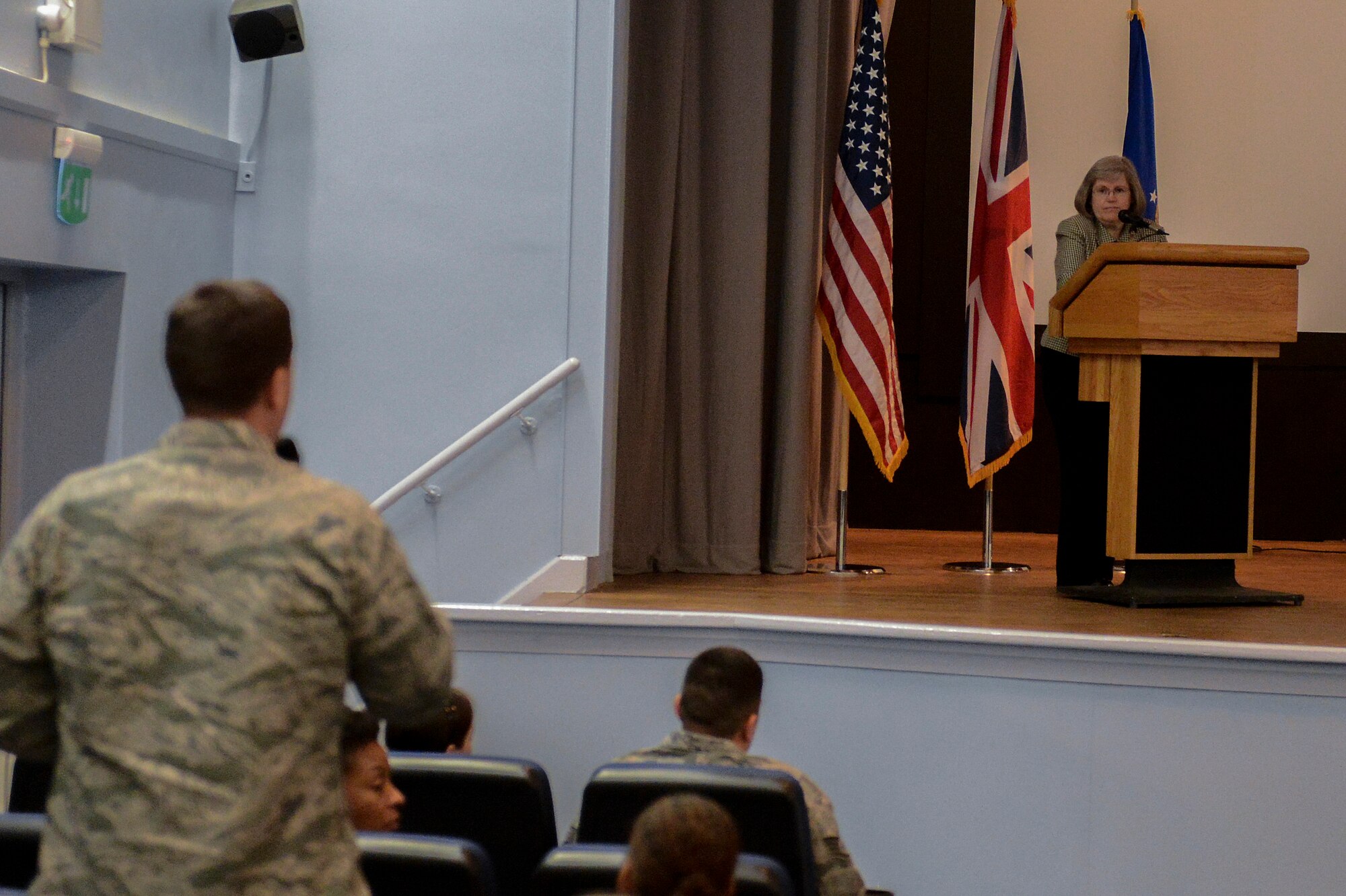 Holly Petraeus, director of the Consumer Finanical Protection Bureau’s Office of Servicemember Affairs, answers questions asked by 48th Fighter Wing Airmen during a town hall meeting at Royal Air Force Lakenheath, England, May 23, 2014. During her visit to RAF Lakenheath, Petraeus explained her role in the CFPB and answered questions from service members. (U.S. Air Force photo by Airman 1st Class Trevor T. McBride/Released)