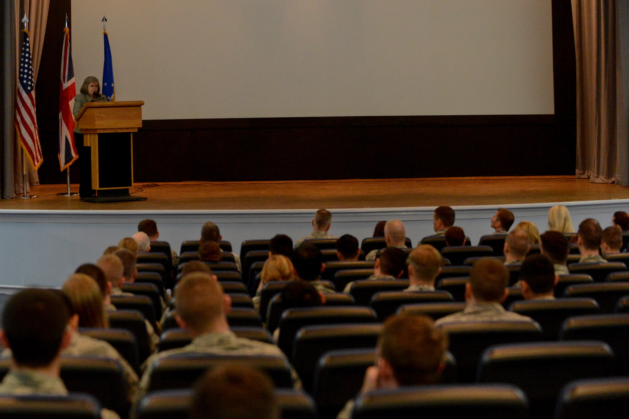 Holly Petraeus, director of the Consumer Finanical Protection Bureau’s Office of Servicemember Affairs, explains her role within CFPB during a finanical town hall meeting at Royal Air Force Lakenheath, England, May 23, 2014. The OSA ensures that military personnel and their families have a voice at the CFPB. (U.S. Air Force photo by Airman 1st Class Trevor T. McBride/Released)