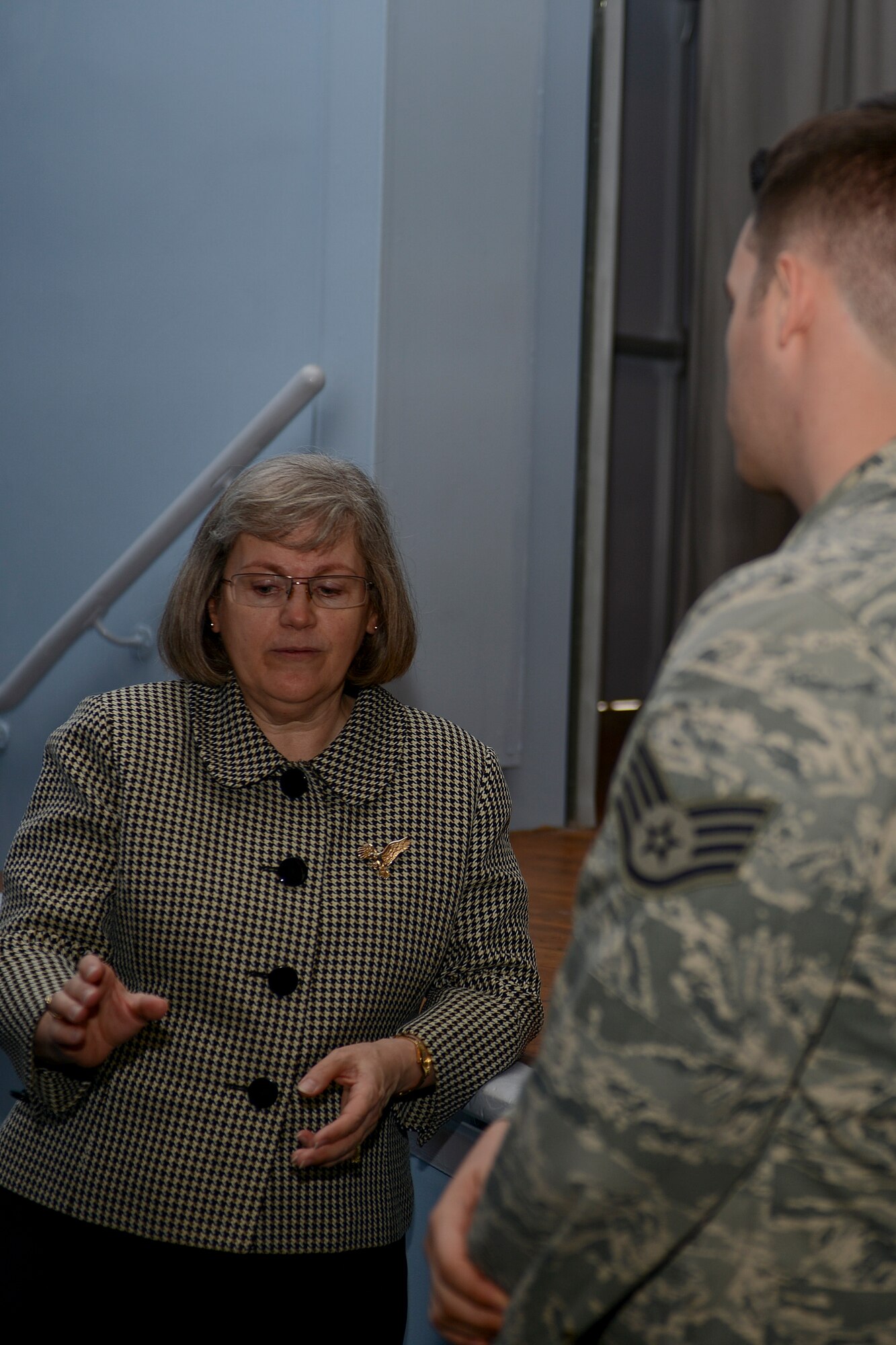Holly Petraeus, director of the Consumer Finanical Protection Bureau’s Office of Servicemember Affairs, speaks with Staff Sgt. Alex Egan, 48th Aerospace Medical Squadron bioenvironmental engineering supervisor, after a town hall meeting at Royal Air Force Lakenheath, England, May 23, 2014. During her visit to RAF Lakenheath, Petraeus explained her role in the CFPB and answered questions from service members. (U.S. Air Force photo by Airman 1st Class Trevor T. McBride/Released)
