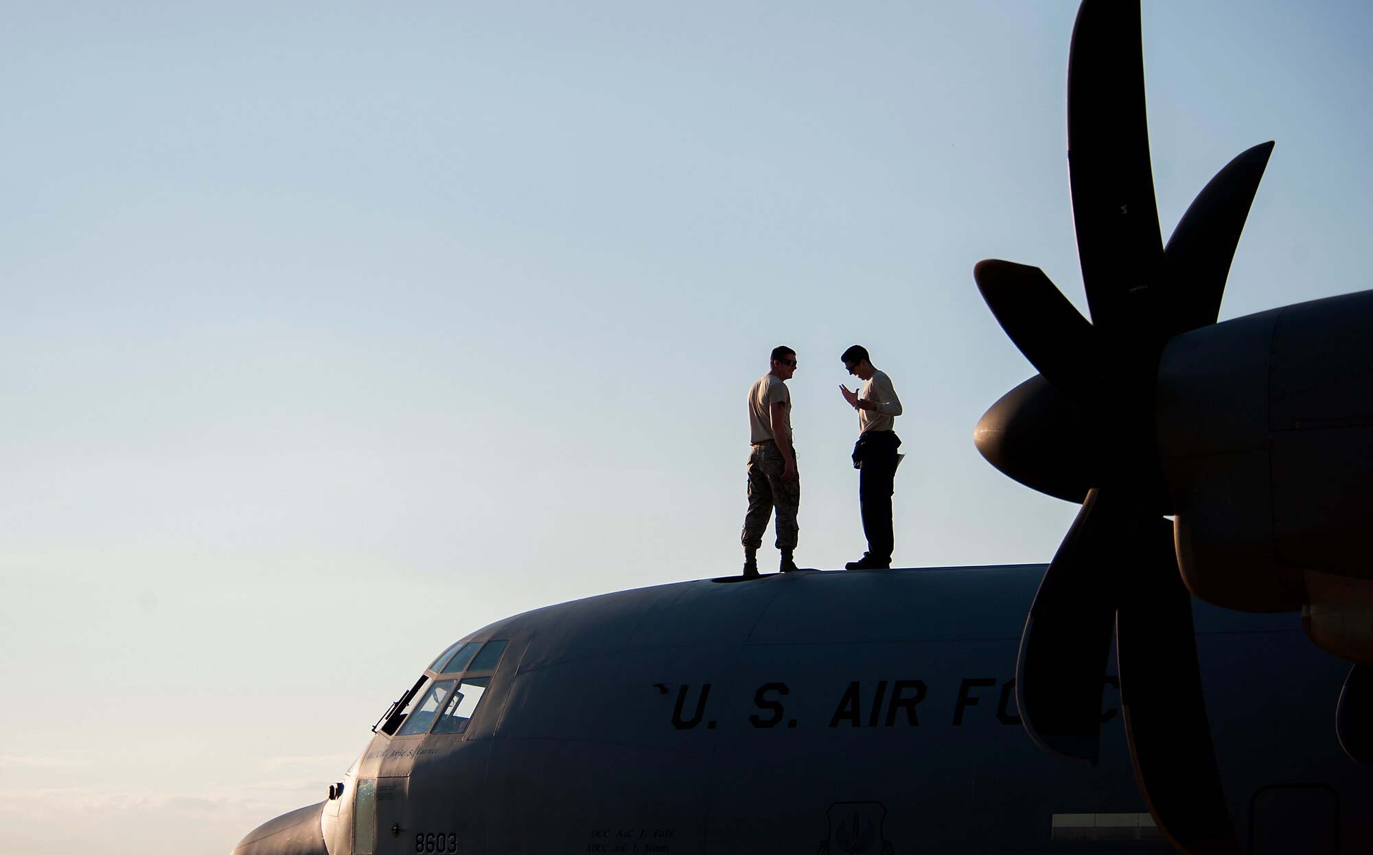 Members of the 86th Aircraft Maintenance Squadron inspect the top of a C-130J Super Hercules during Carpathian Spring 2014 in Bucharest, Romania, May 19, 2014. Members of the 86th AMXS supported the training with more than 20 Airmen to help maintain aircraft to ensure U.S. and Romanian service members were able to complete training requirements. (U.S. Air Force photo/Senior Airman Damon Kasberg