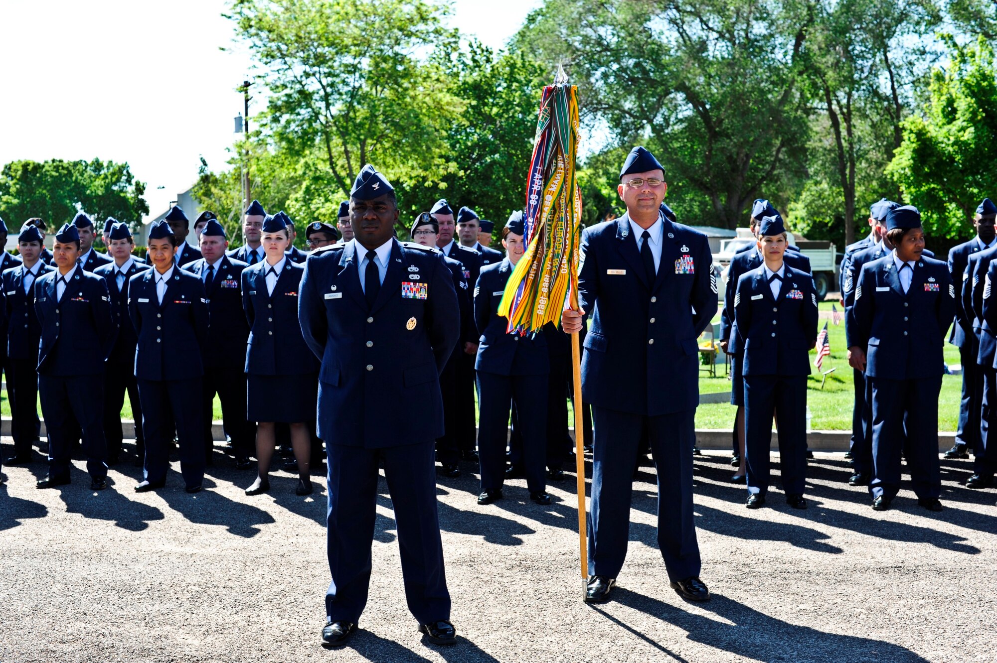 Col. Michael Lawrence, 366th Maintenance Group commander; Chief Master Sgt. Alex del Valle, 366th Fighter Wing command chief, and a formation of Airmen from the 366th FW stand at parade rest at a Memorial Day observance at Mountain View Cemetery in Mountain Home, Idaho, May 26, 2014. Several hundred servicemembers, local police and veterans from the Mountain Home and greater Snake River are attended the event. (U.S. Air Force photo by Master Sgt. Kevin Wallace/RELEASED)