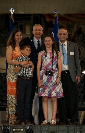 Brig. Gen. Darren Hartford gathers with his family for a group photo during his promotion ceremony May 22, 2014, at the HSC Hangar on Joint Base Charleston, S.C. Hartford's next assignment is commander, 379th Air Expeditionary Wing in Al Udeid. (U.S. Air Force photo/ Airman 1st Class Clayton Cupit)