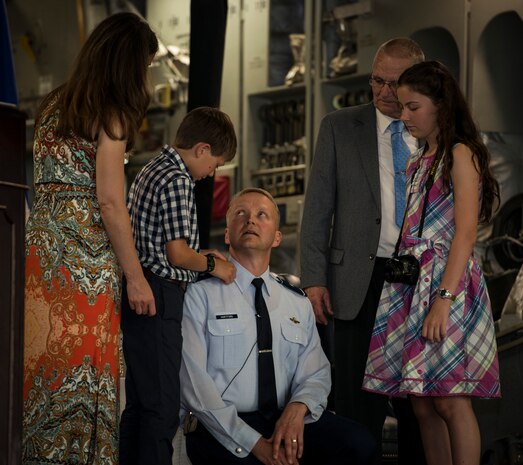 Brig. Gen. Darren Hartford gets his brigadier general stars put on by family members during his promotion ceremony May 22, 2014, at the HSC Hangar on Joint Base Charleston, S.C. Hartford's next assignment is commander, 379th Air Expeditionary Wing in Al Udeid. (U.S. Air Force photo/ Airman 1st Class Clayton Cupit)