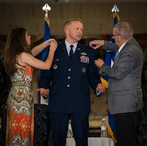Brig. Gen. Darren Hartford gets his brigadier general stars pinned on by familiy members during his promotion ceremony May 22, 2014, at the HSC Hangar on Joint Base Charleston, S.C. Hartford's next assignment is commander, 379th Air Expeditionary Wing in Al Udeid. (U.S. Air Force photo/ Airman 1st Class Clayton Cupit)