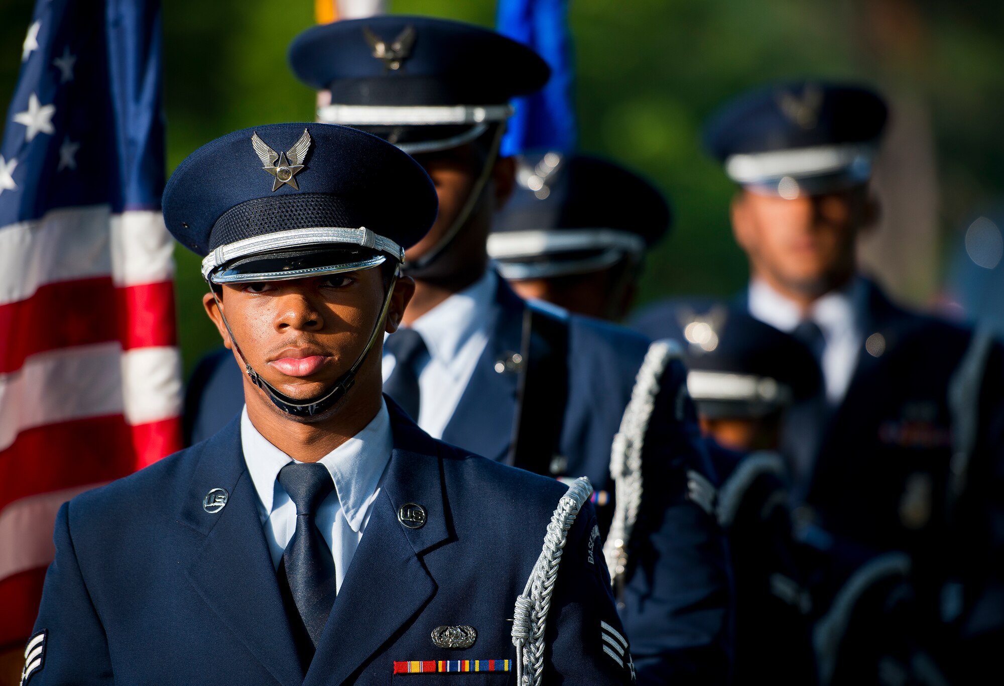 The 96th Test Wing honor guard stands ready to present the colors at the 29th annual Gate-to-Gate Run May 24 at Eglin Air Force Base, Fla. More than 1,200 people participated in the 4.4-mile race. Many of the runners paid their respects by dropping off flowers in front of the All Veterans Memorial as they raced by. (U.S. Air Force photo/Samuel King Jr.)