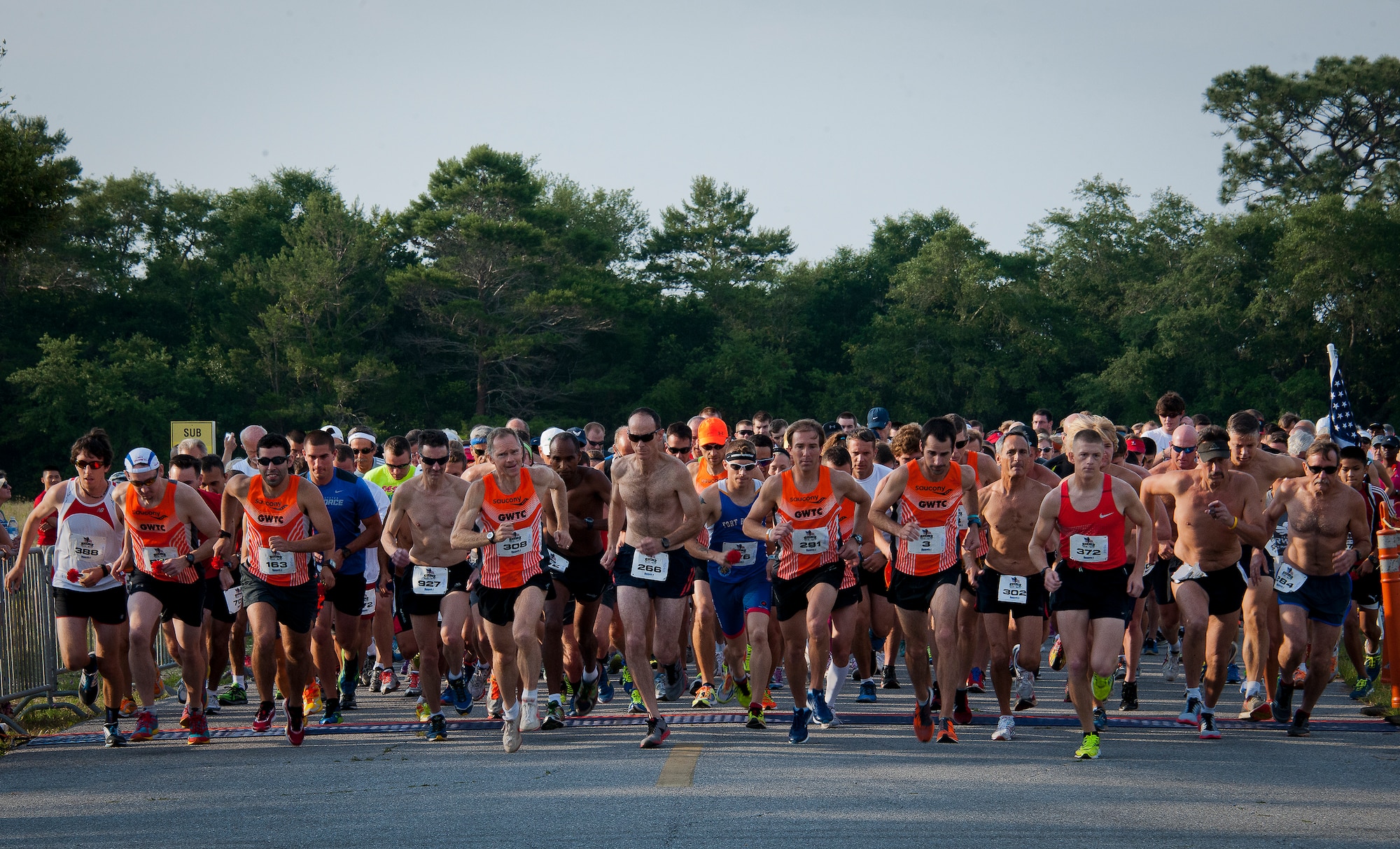 The 29th annual Gate-to-Gate Run begins May 24 at Eglin Air Force Base, Fla. More than 1,200 people participated in the 4.4 mile race. Many of the runners paid their respects by dropping off flowers in front of the All Veterans Memorial as they raced by. (U.S. Air Force photo/Samuel King Jr.)