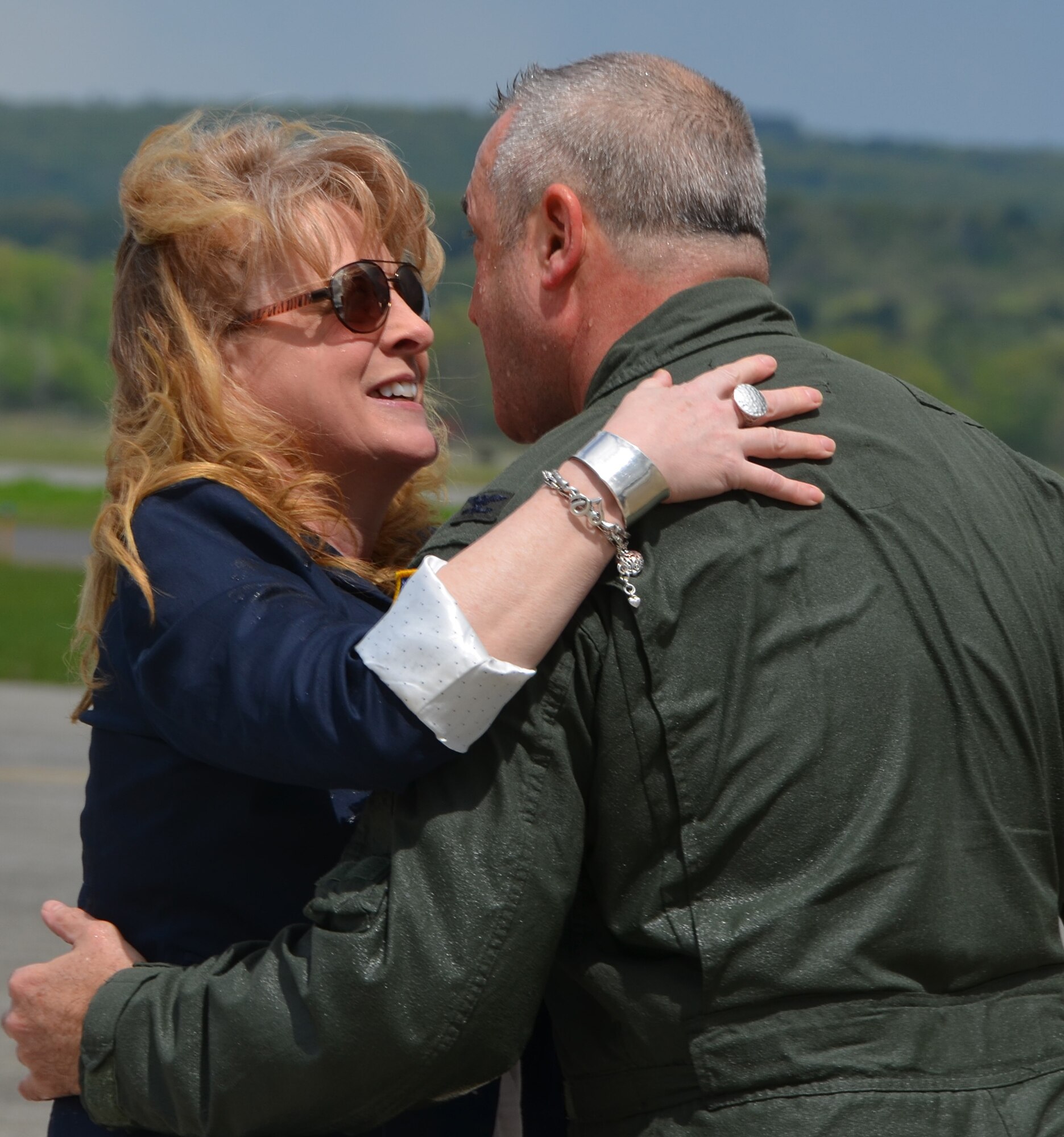 Col. Jeffrey Hancock embraces his wife, Debbie, after his fini flight and landing at Westover, May 19, 2014. (US Air Force photo/MSgt. Andrew Biscoe)