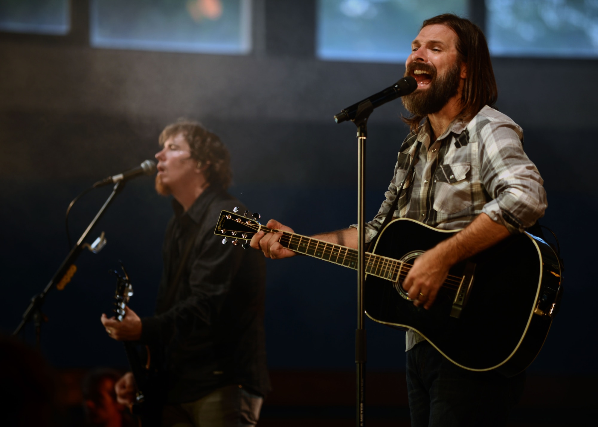Mark Lee, left, and Mac Powell, Third Day co-founders, sing to Team Mildenhall members May 23, 2014, RAF Mildenhall, England. The band visited RAF Mildenhall as part of a United Service Organizations tour. (U.S. Air Force photo by Airman 1st Class Preston Webb/Released)
