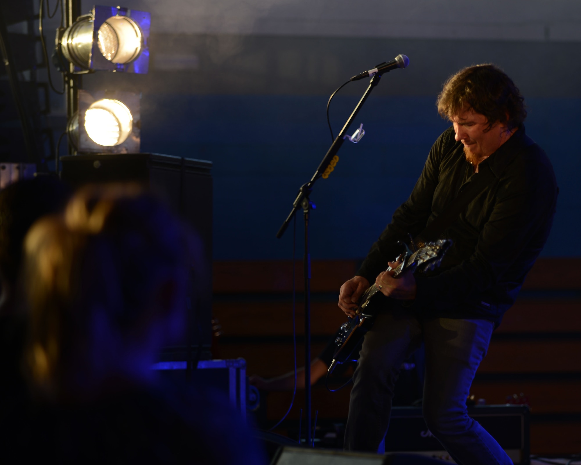 Mark Lee, Third Day co-founder, performs a solo during an United Service Organizations concert May 23, 2014, on RAF Mildenhall, England. The band took requests from Team Mildenhall members to entertain the attendees. (U.S. Air Force photo by Airman 1st Class Preston Webb/Released)