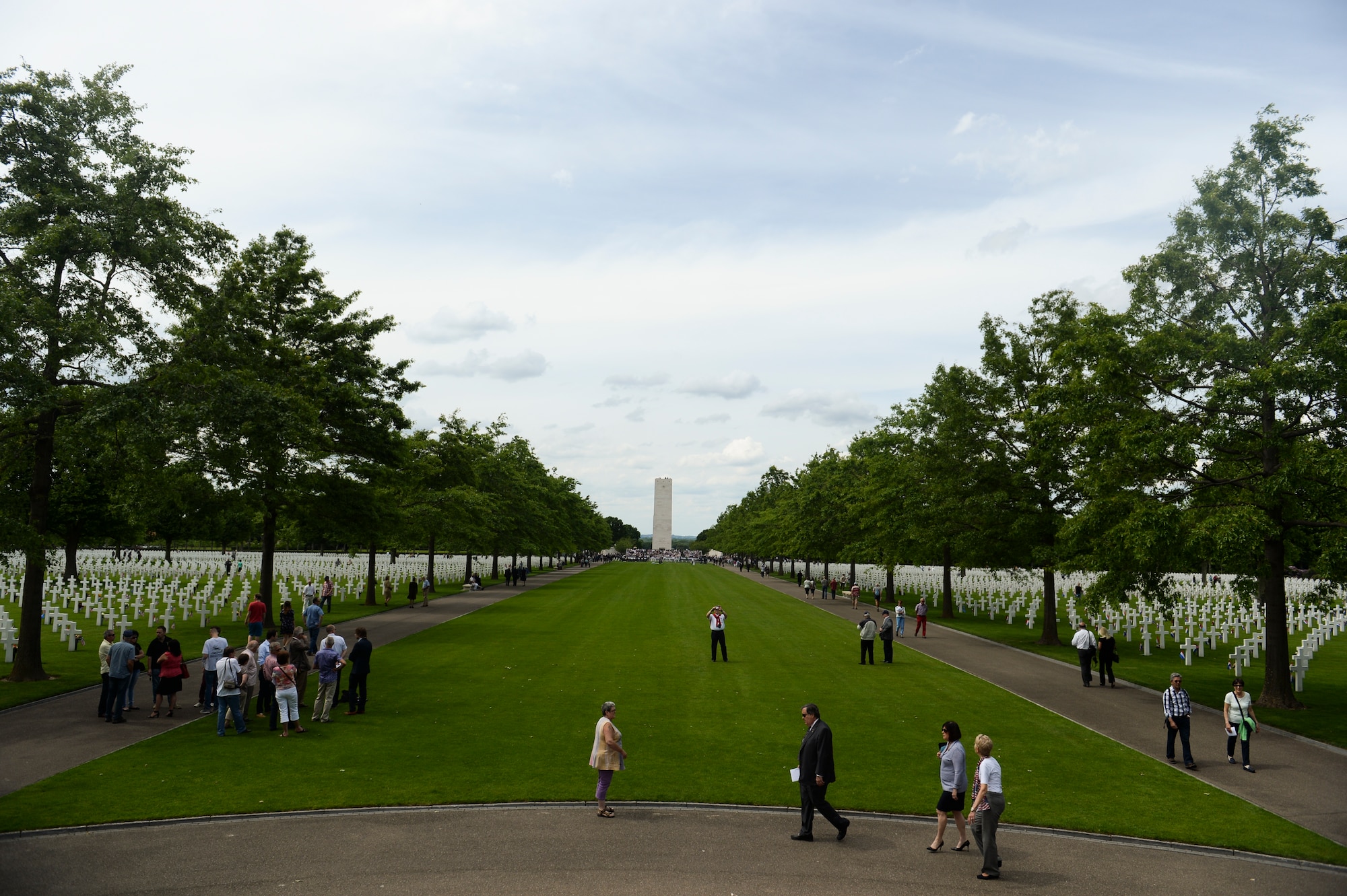 People visit the Netherlands American Cemetery prior to the start of a Memorial Day ceremony May 25, 2014, at Margraten, Netherlands. More than 8,000 American service members are interred at the cemetery. (U.S. Air Force photo by Senior Airman Rusty Frank/Released)