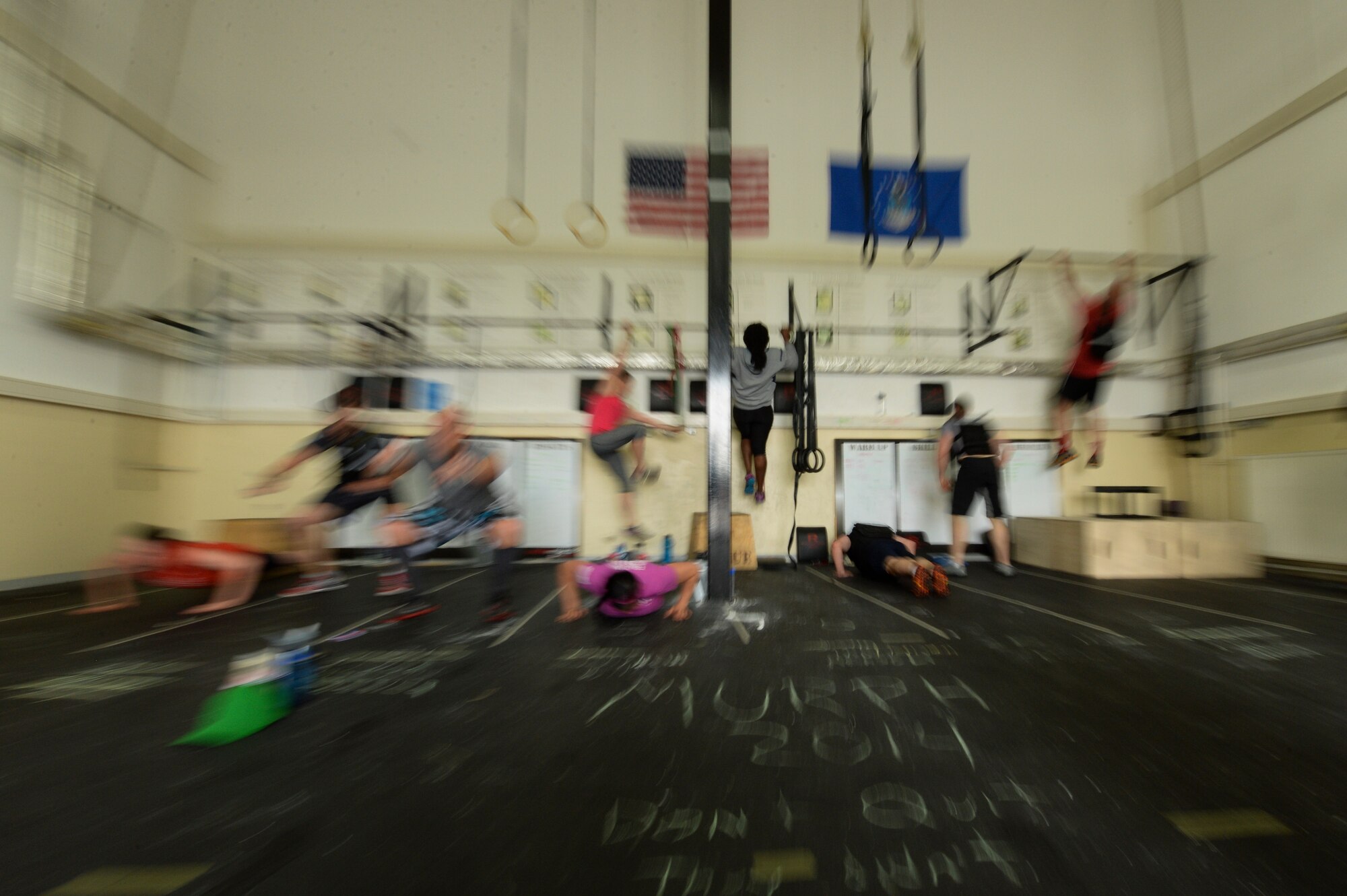 Spangdahlem Airmen participate in a "Murph" workout during a "Murph" Challenge May 23, 2014, at Spangdahlem Air Base, Germany. The “Murph” is a high-intensity workout that consists of a two one-mile runs, 100 pull-ups, 200 push-ups and 300 squats while wearing a 20-pound vest. (U.S. Air Force photo by Senior Airman Rusty Frank/Released)