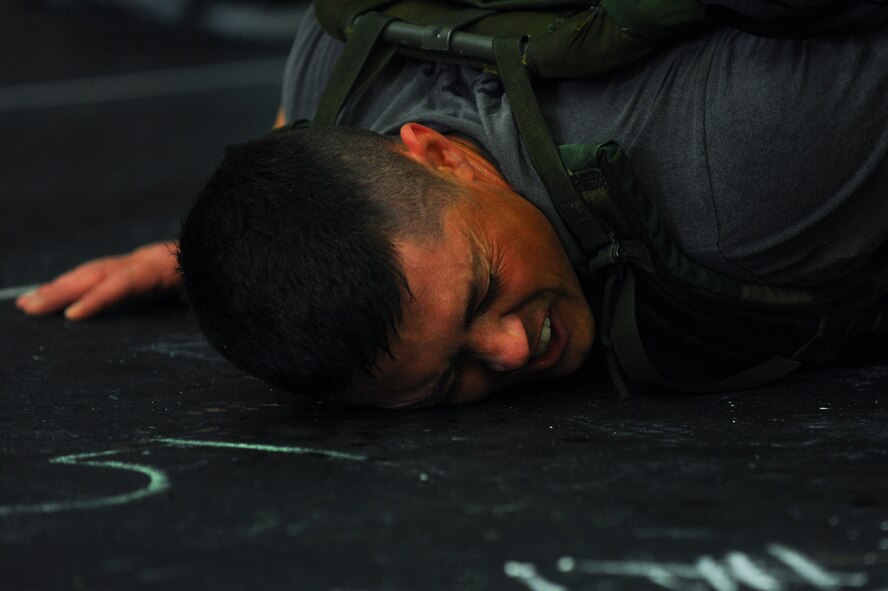 Dave Esra, 52nd Force Support Squadron recreation assistant, rests during a combat fitness workout as a part of a "Murph" Challenge May 23, 2014, at Spangdahlem Air Base, Germany. The event is held annually in memoriam of the actions of U.S. Navy Lt. Michael Murphy. More than 67 Airmen participated in the event. (U.S. Air Force photo by Senior Airman Rusty Frank/Released)