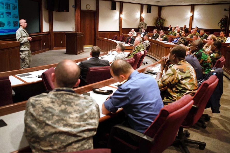 HANSCOM AIR FORCE BASE, Mass. – Col. Lester A. Weilacher, 66th Air Base Group commander, welcomes officials from a Multinational Foreign Attaché visit to the base during opening remarks at the Hanscom Conference Center, May 15. The group received an Air Force Life Cycle Management Center mission overview and viewed C3I and Networks and Battle Management program displays during the visit. (U.S. Air Force photo by Mark Herlihy)